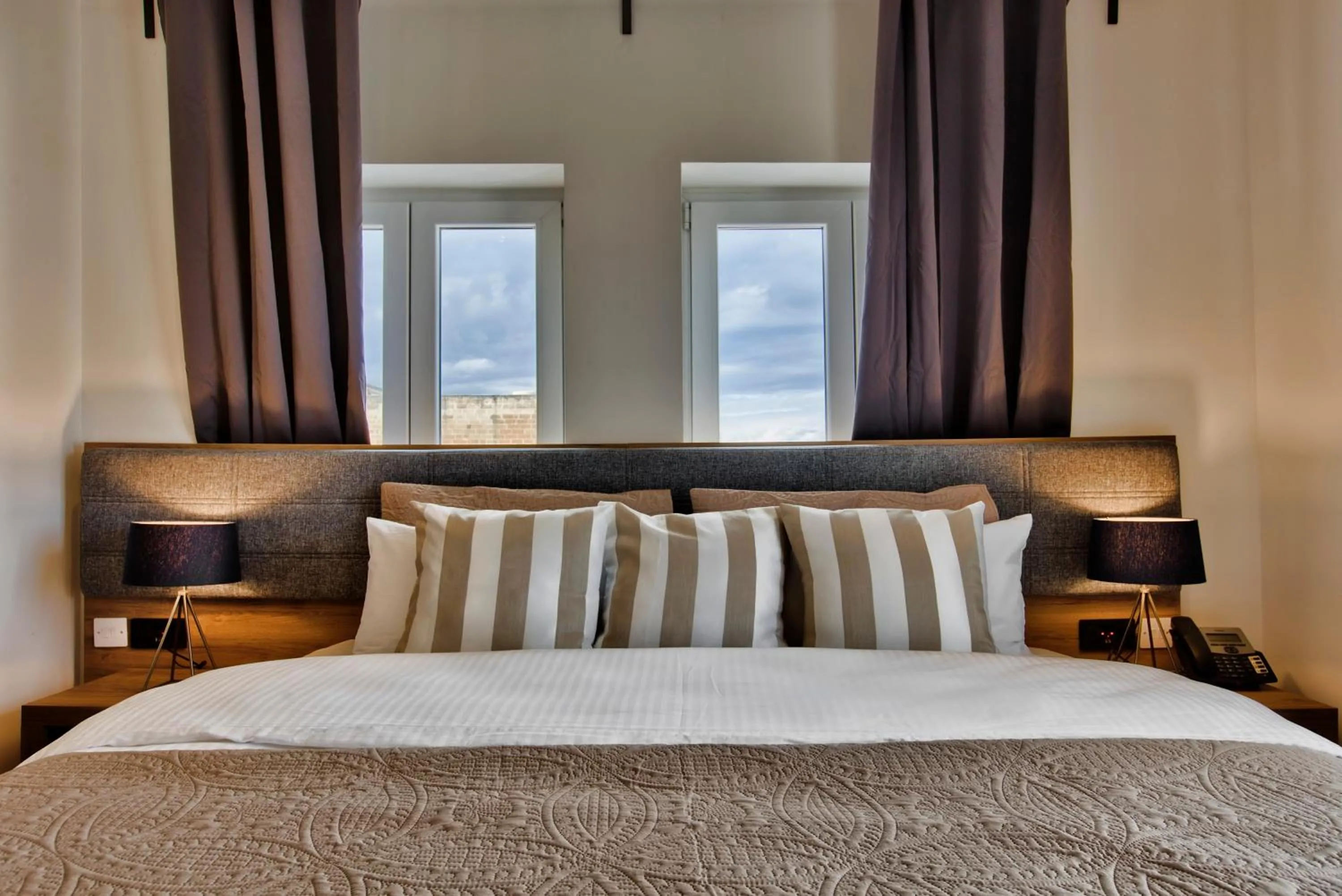 Bed in Tritoni Valletta Boutique Hotel