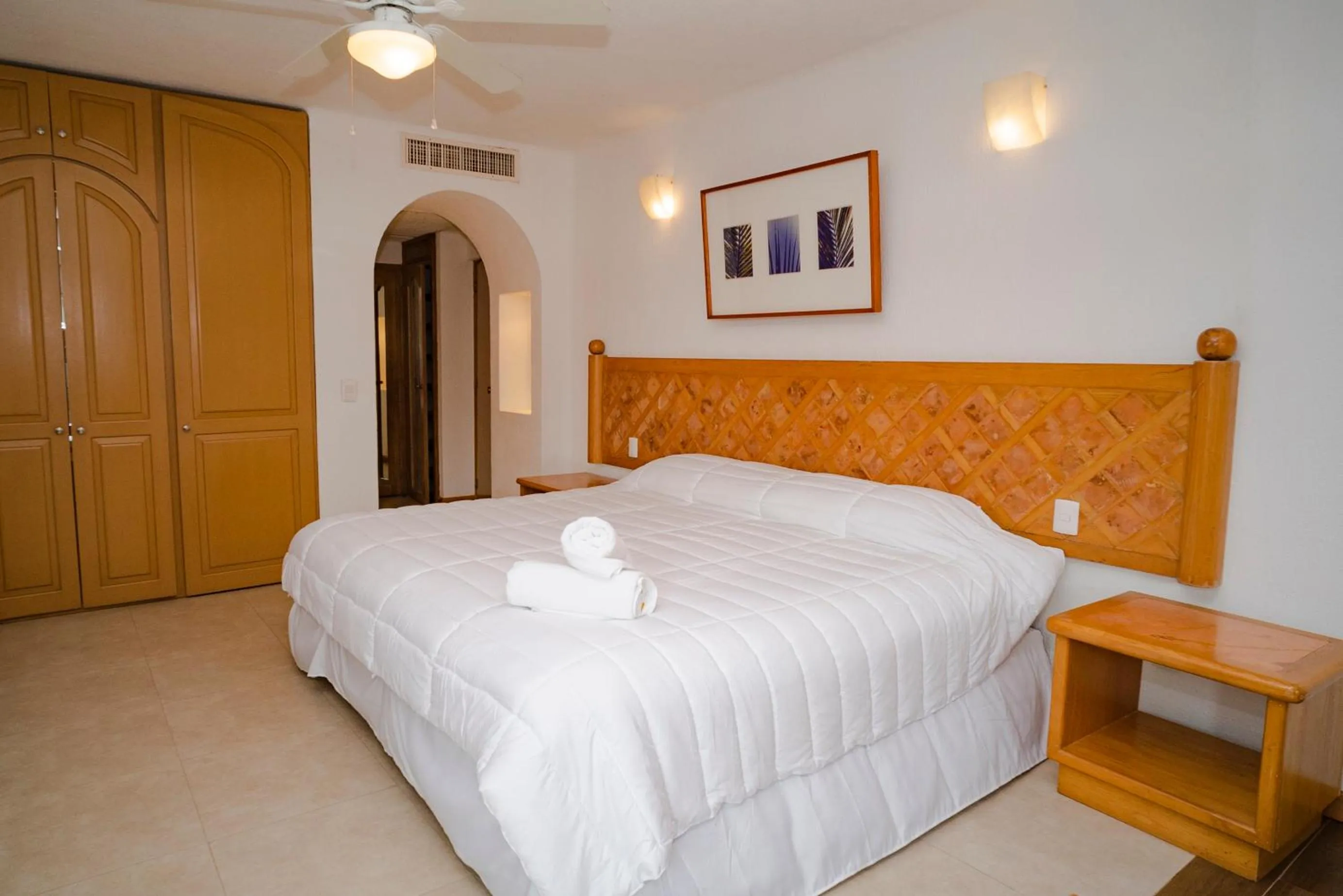 Bedroom, Bed in Oceanfront condo at voted best Cancun sandy beach