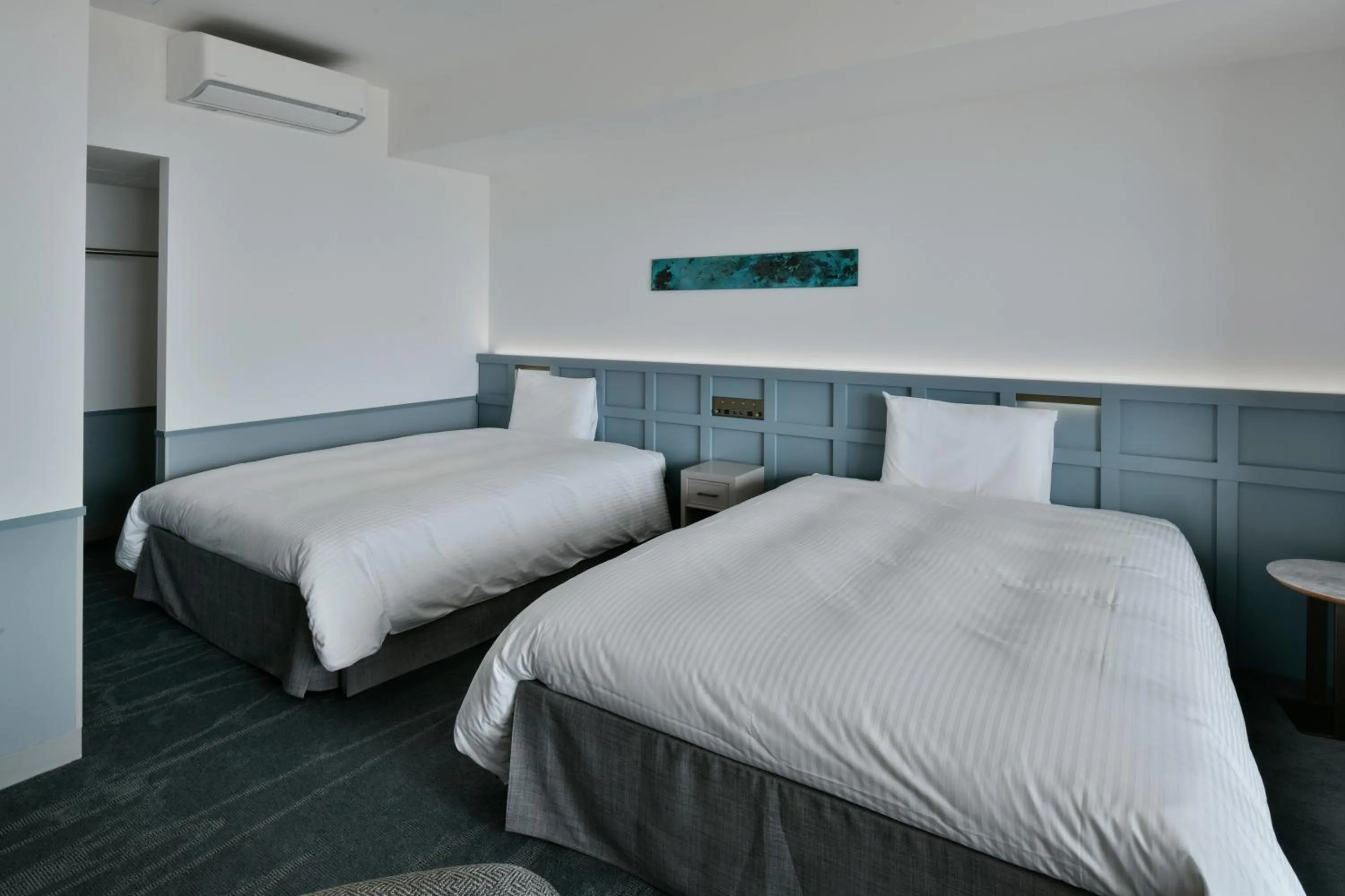 Bed in Lequ Okinawa Chatan Spa ＆ Resort