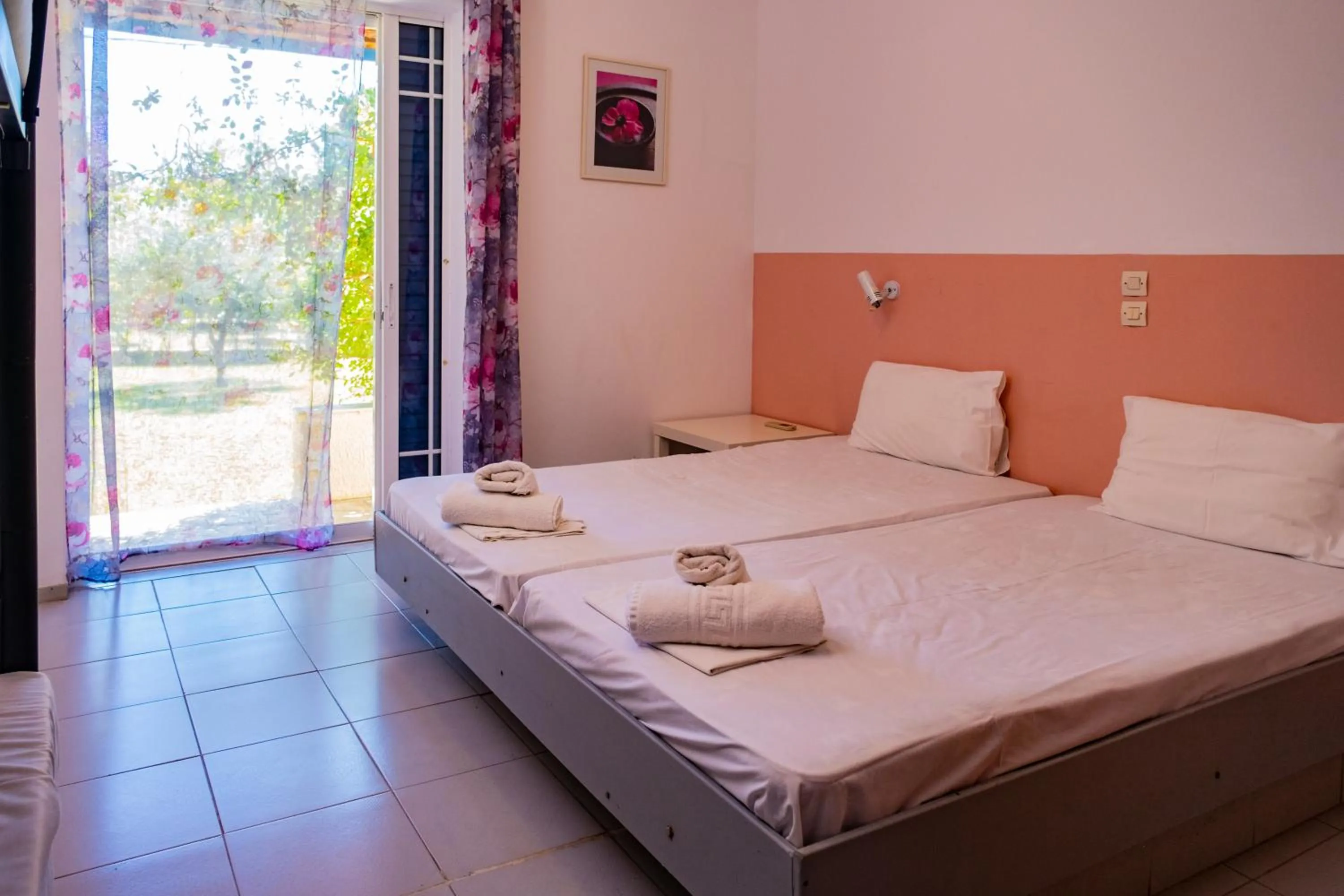 Photo of the whole room, Bed in Tsamadanis Hotel & Bungalows Friends Family