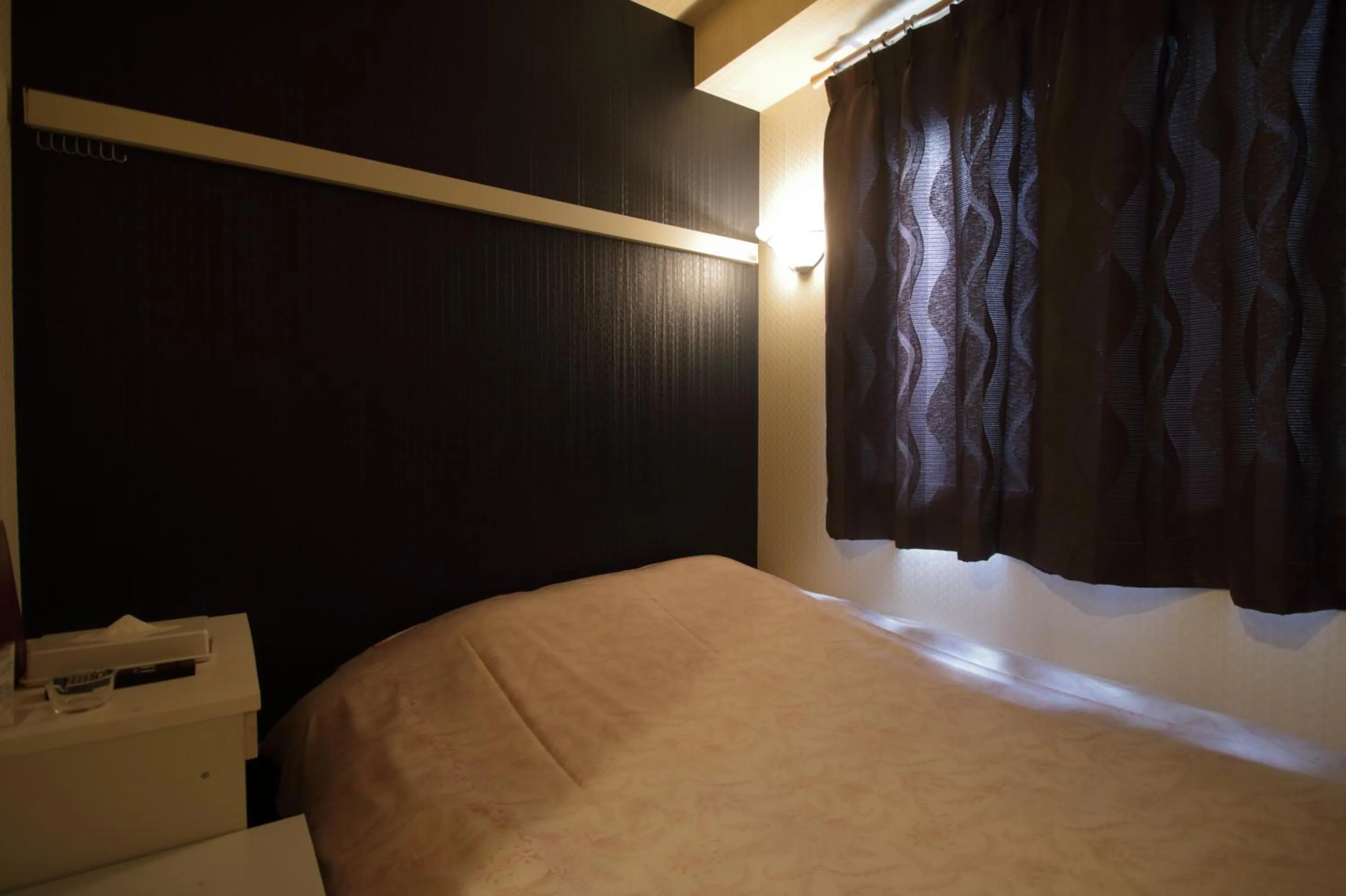 Bed in Tokyo Tourist Inn