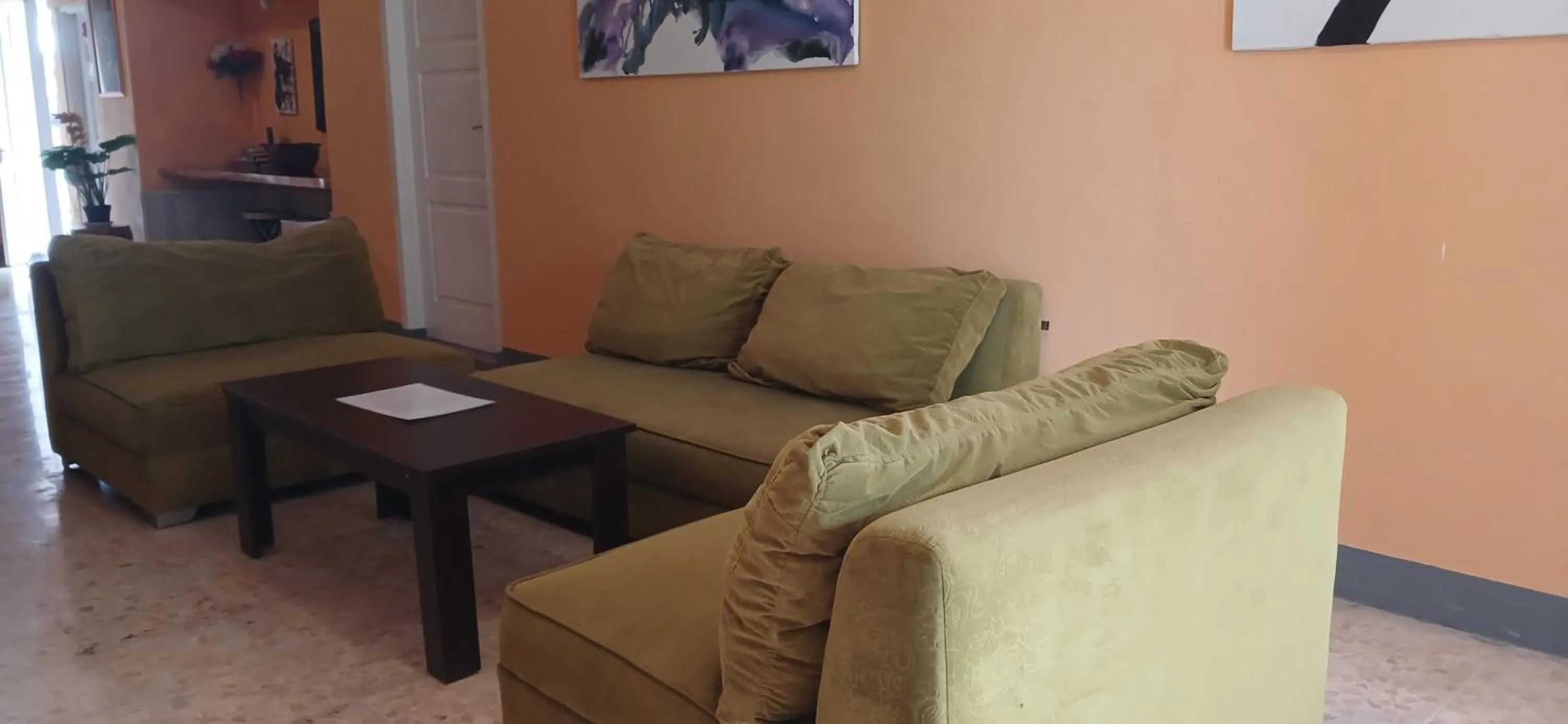 Communal lounge/ TV room in Dewi Sri Guesthouse