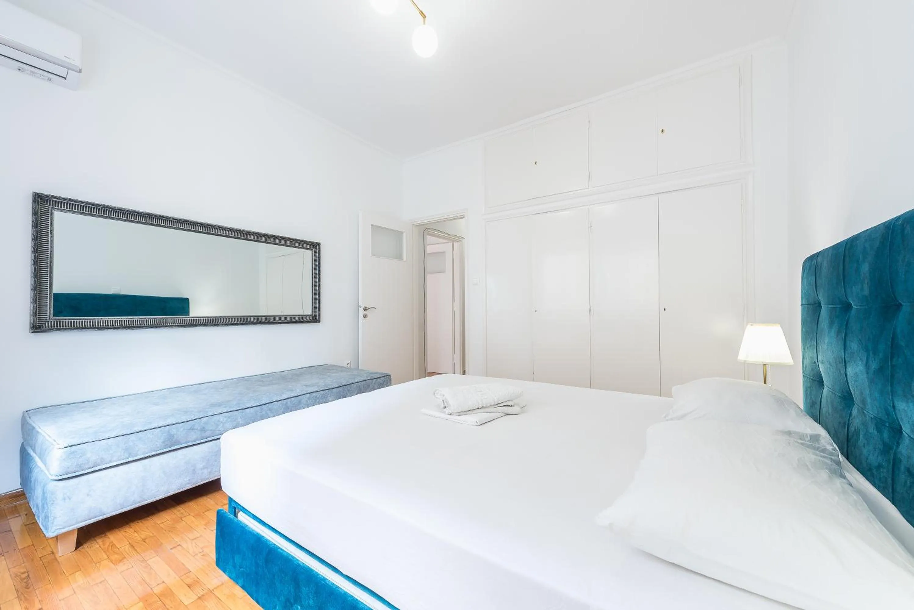 Bed in Victoria Queens Suites Apartments