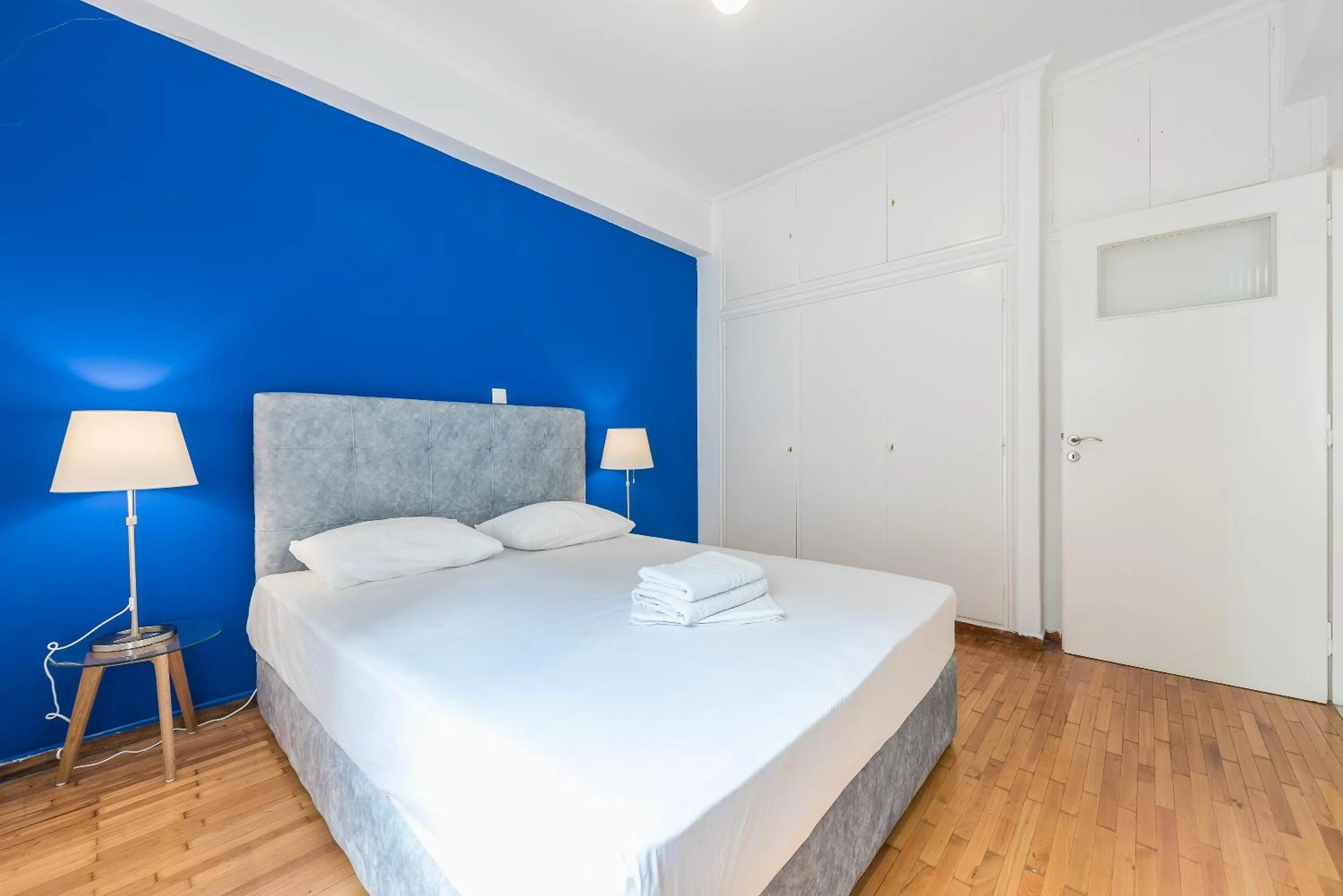 Bed in Victoria Queens Suites Apartments