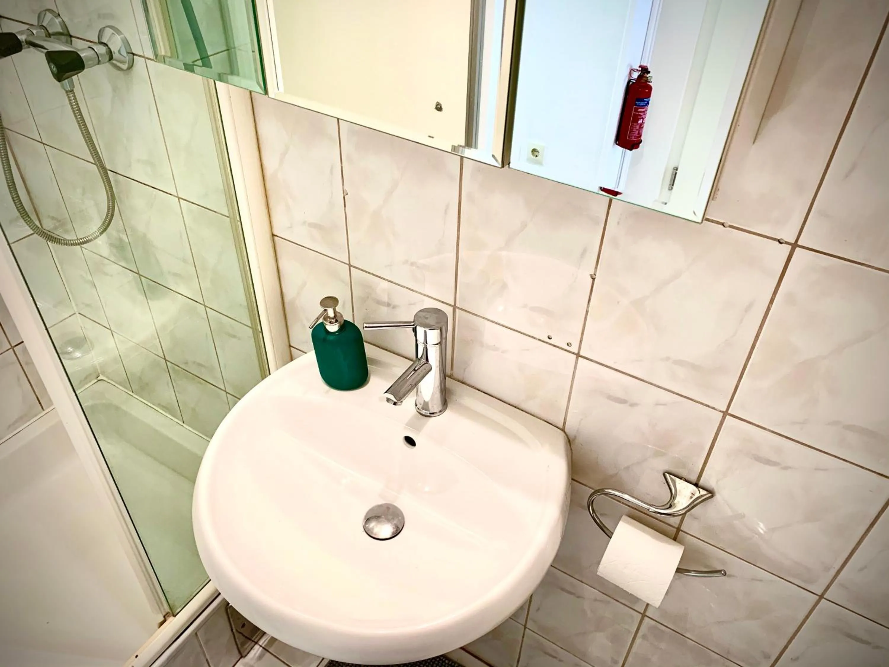 Bathroom in Charming City Apartment - by Nahuen Suites