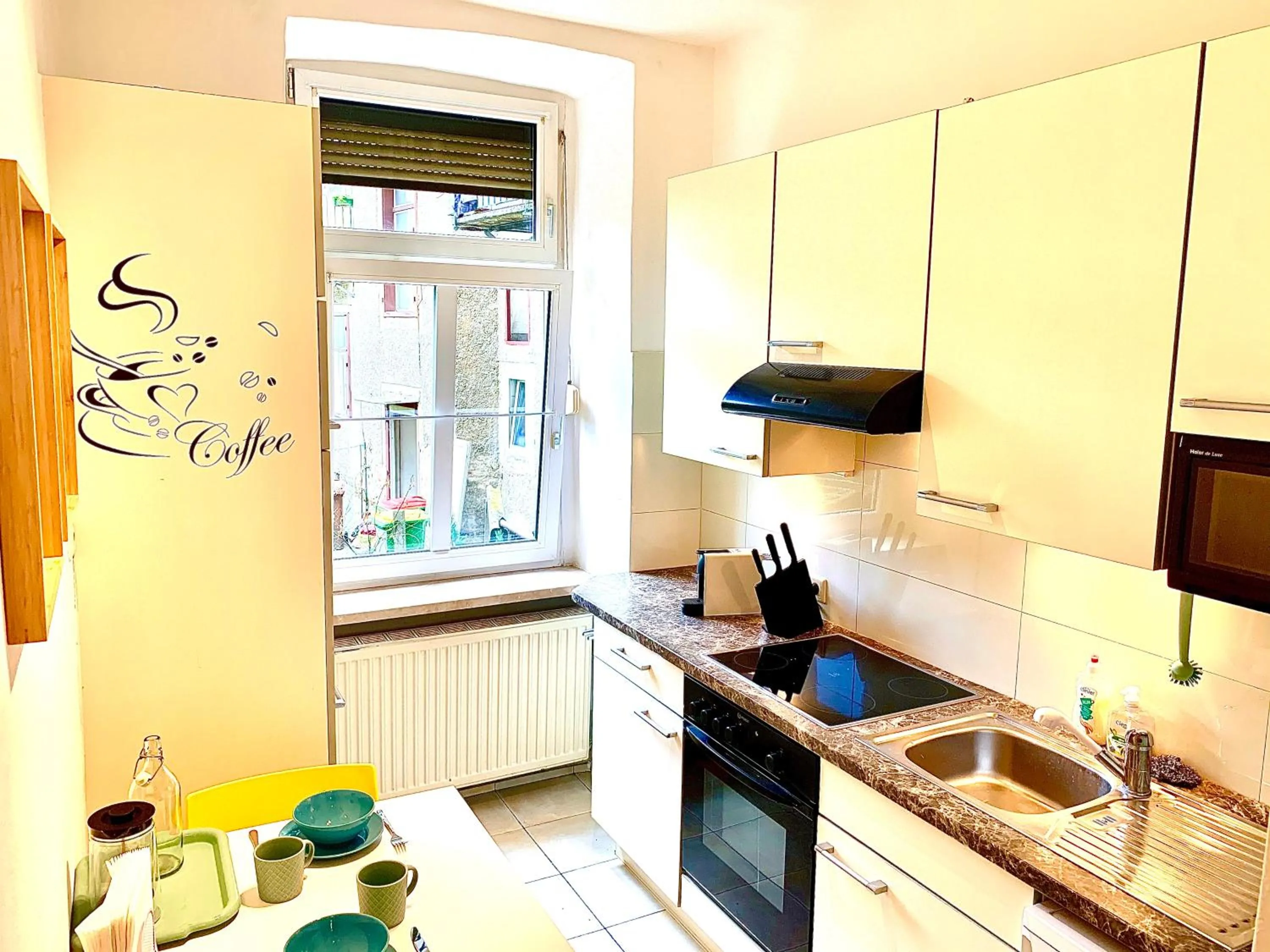 Kitchen or kitchenette in Charming City Apartment - by Nahuen Suites