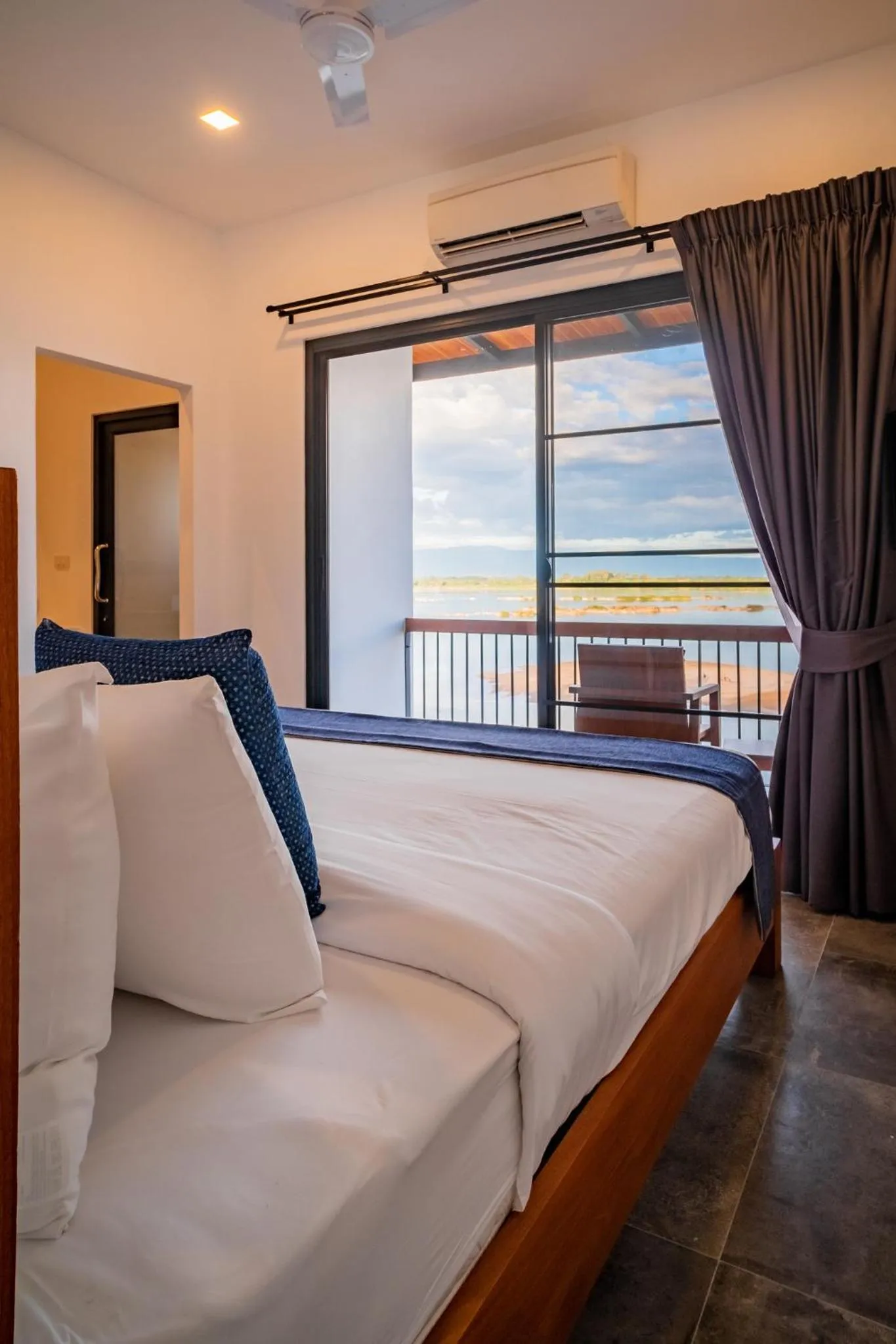 Bed in The Riviera Champasak