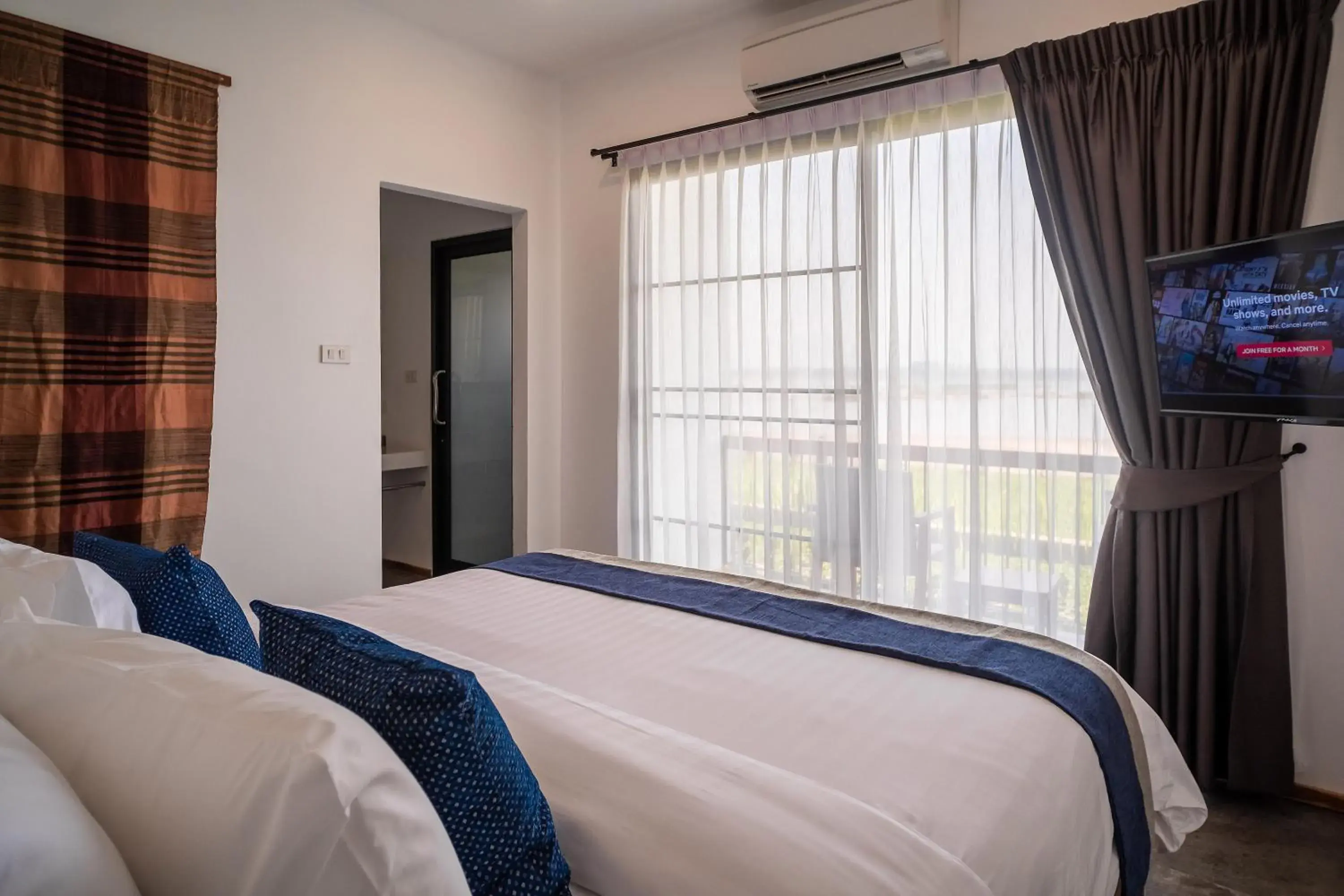 Bed in The Riviera Champasak Bed in The Riviera Champasak