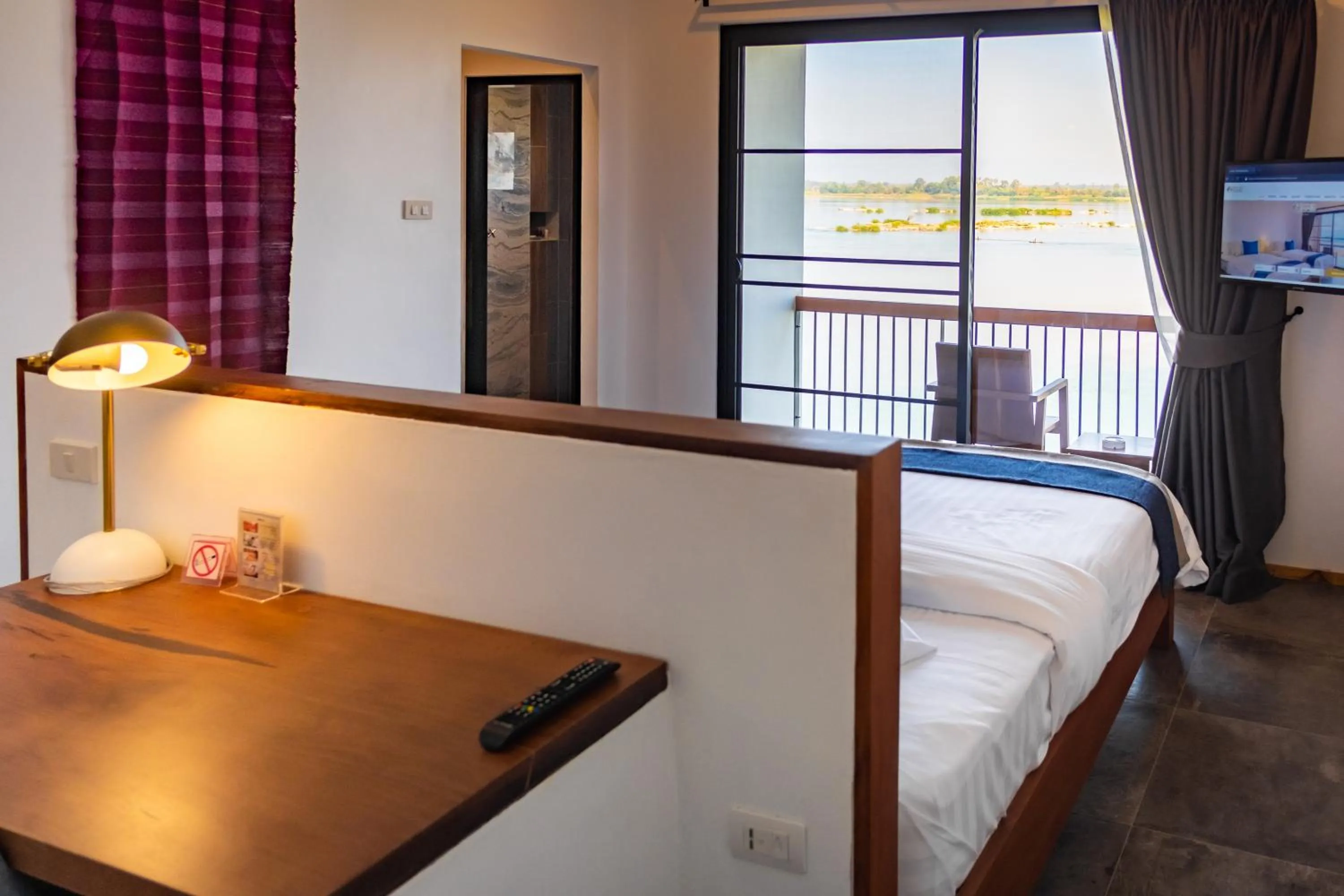 Bed in The Riviera Champasak