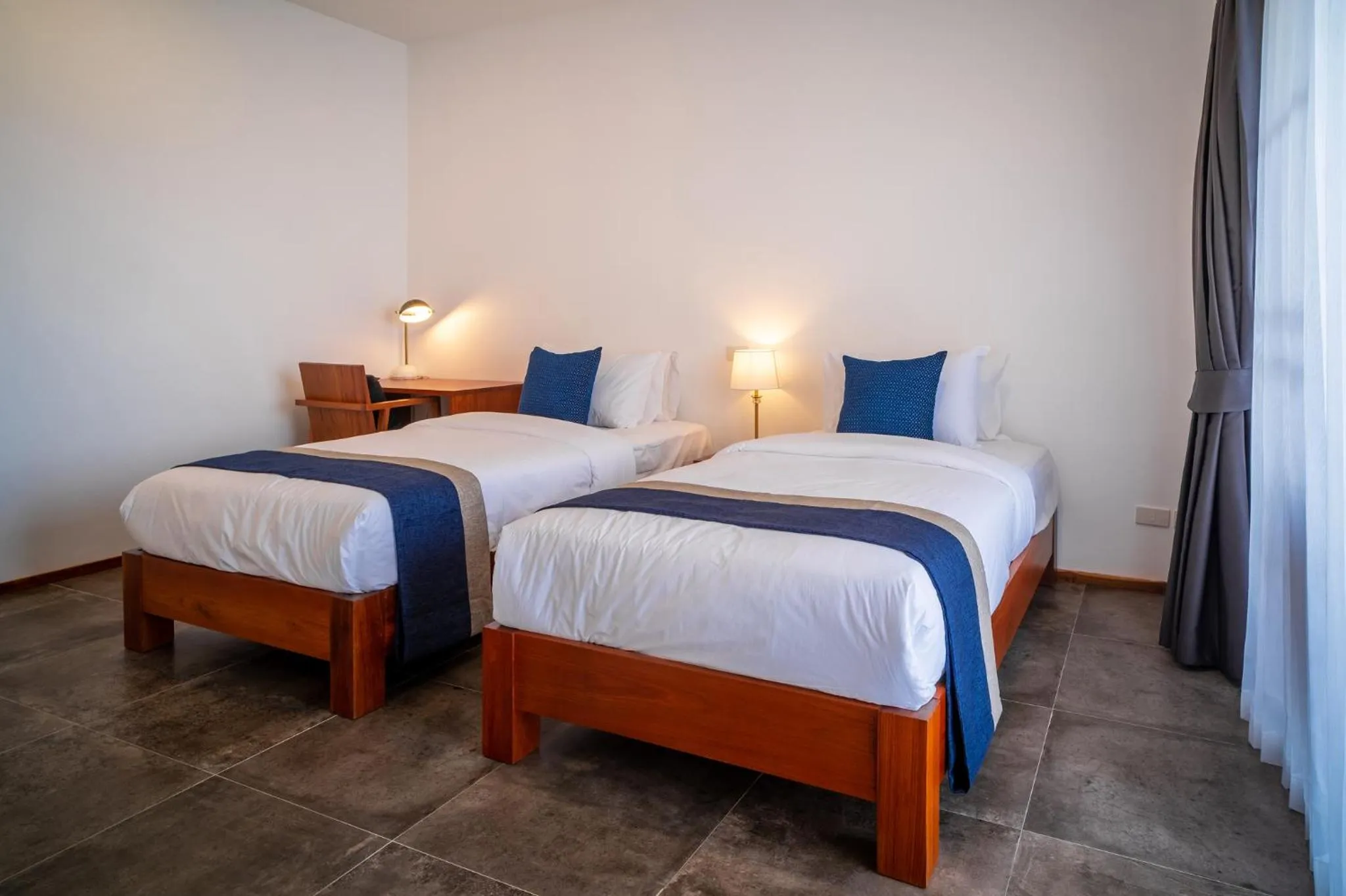 Bed in The Riviera Champasak