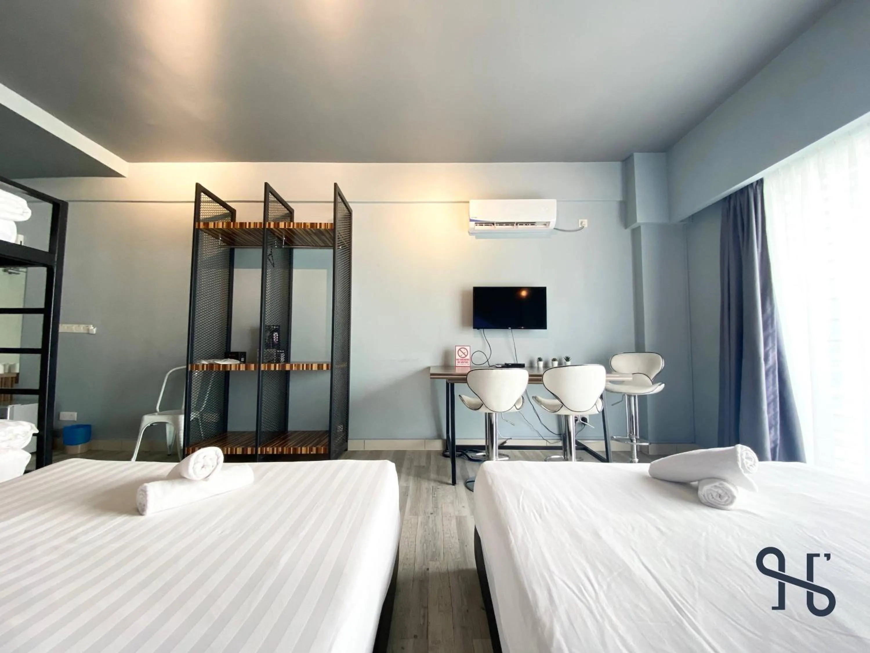 Bed in Homesuite' Home at Aeropod SOVO