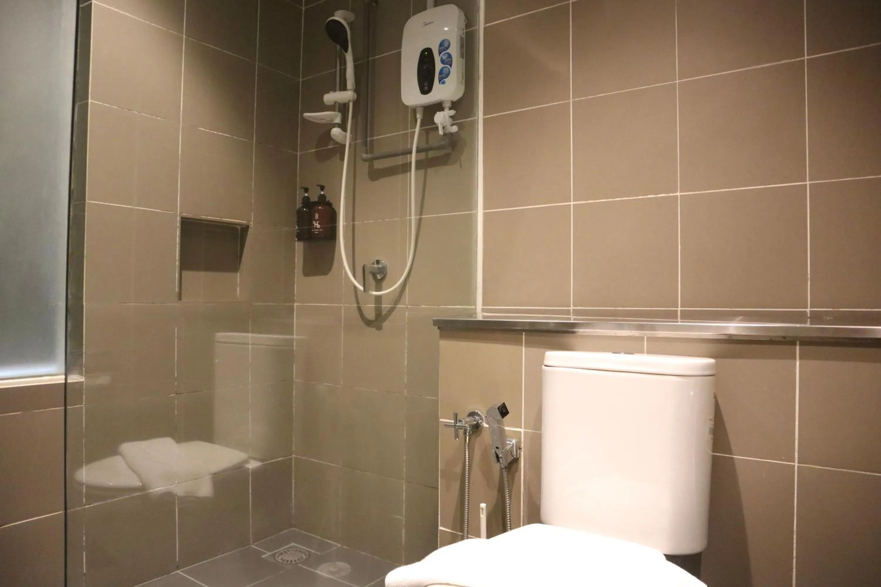 Shower in Homesuite' Home at Aeropod SOVO