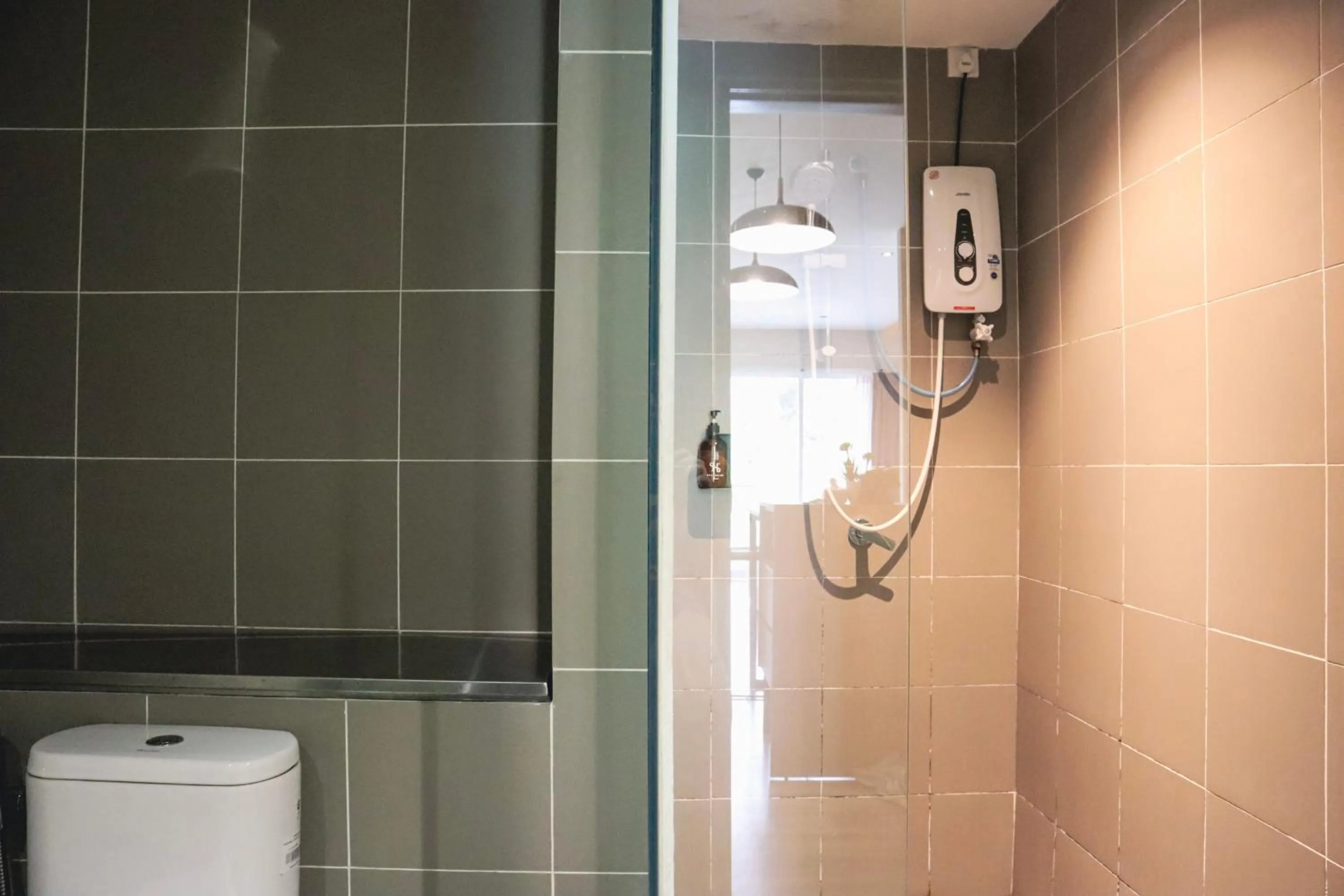 Toilet in Homesuite' Home at Aeropod SOVO