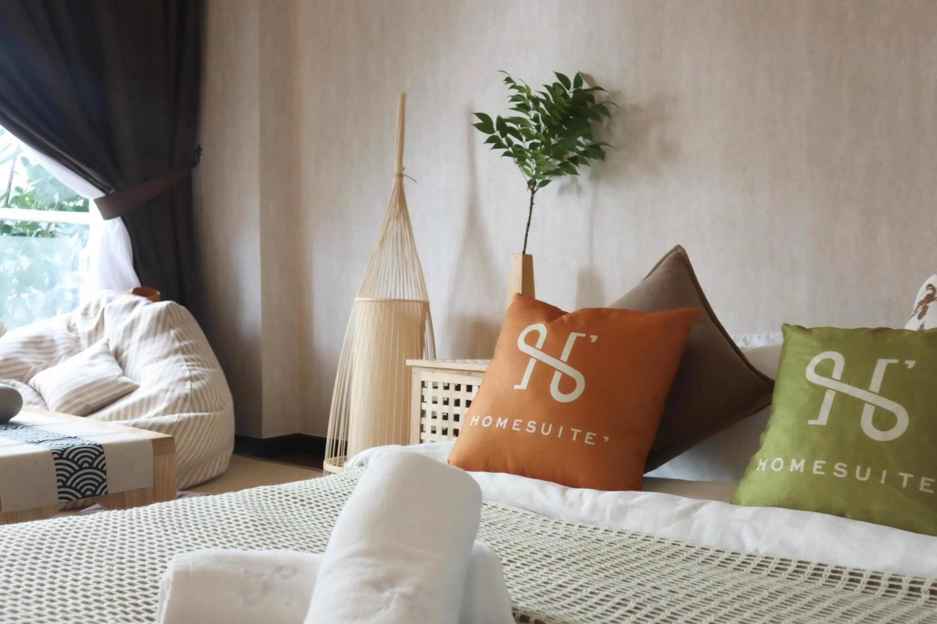 Bed in Homesuite' Home at Aeropod SOVO