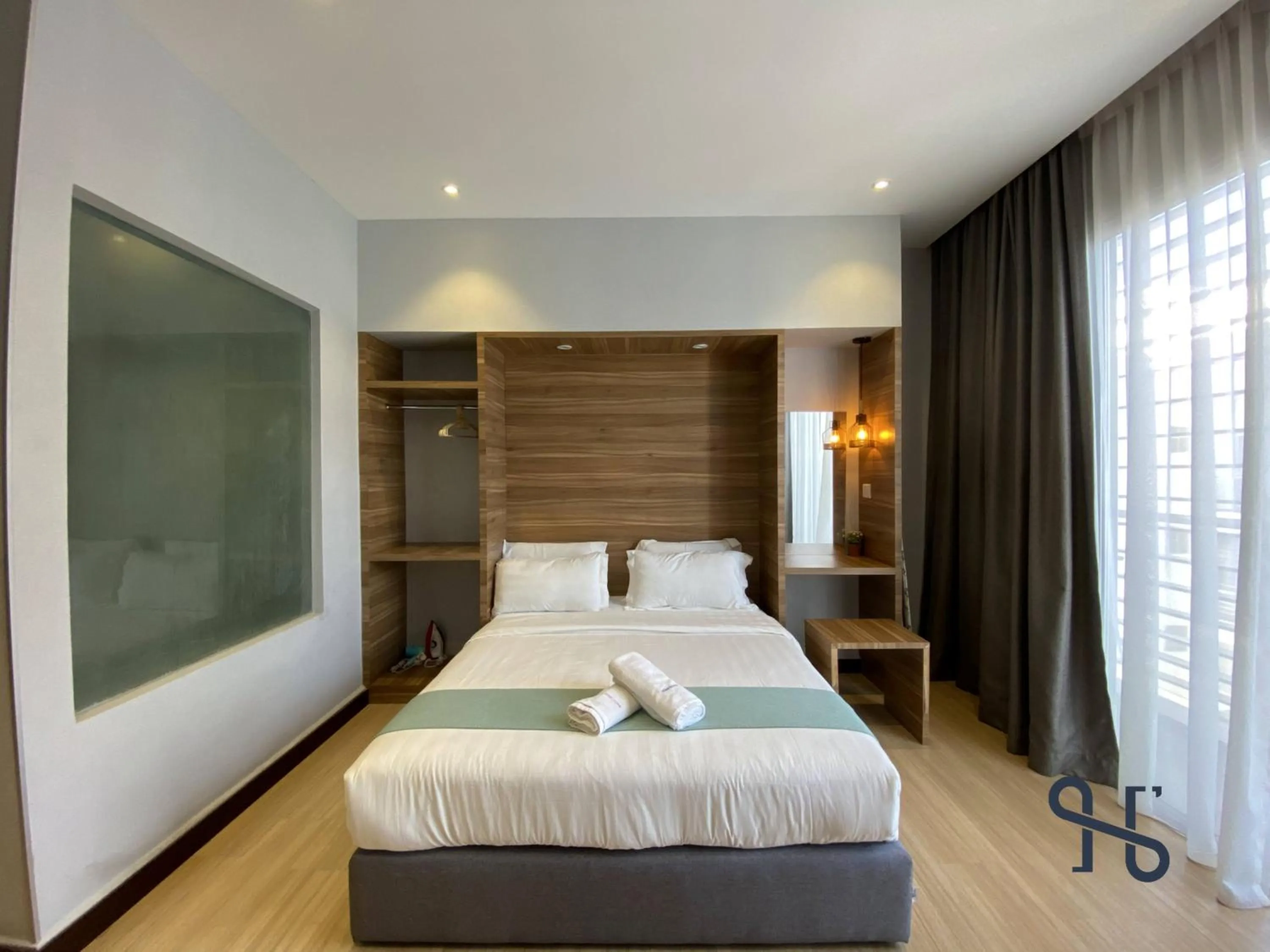 Bed in Homesuite' Home at Aeropod SOVO