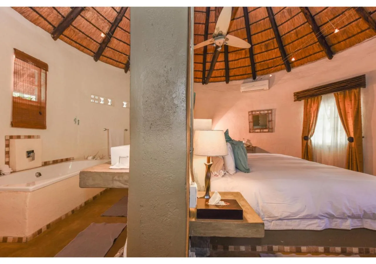 Bed in Mziki Safari Lodge