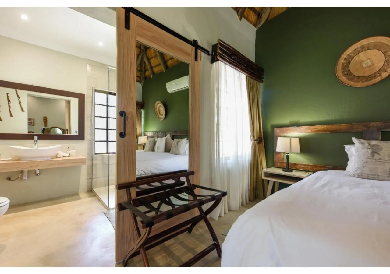 Bed in Mziki Safari Lodge