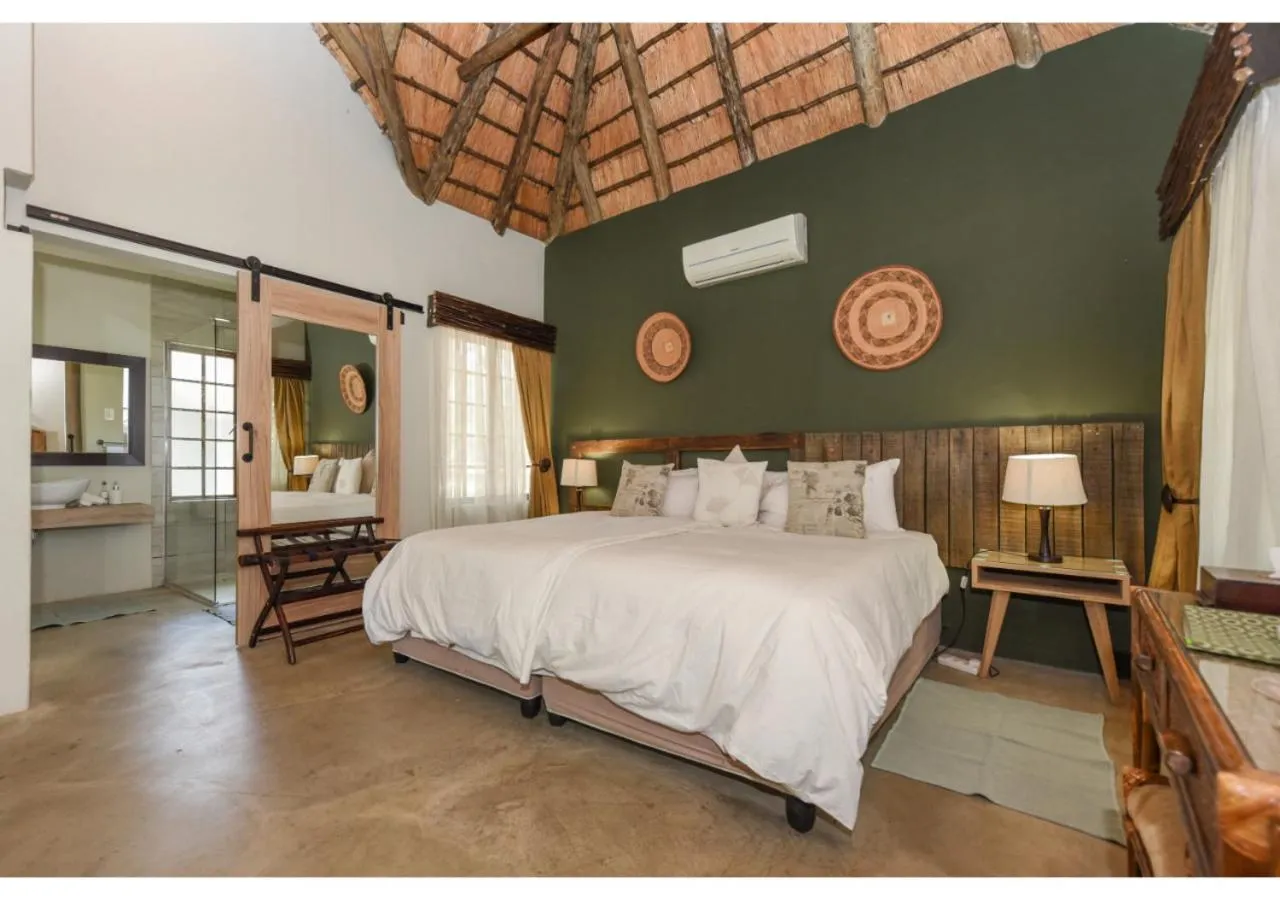 Bed in Mziki Safari Lodge