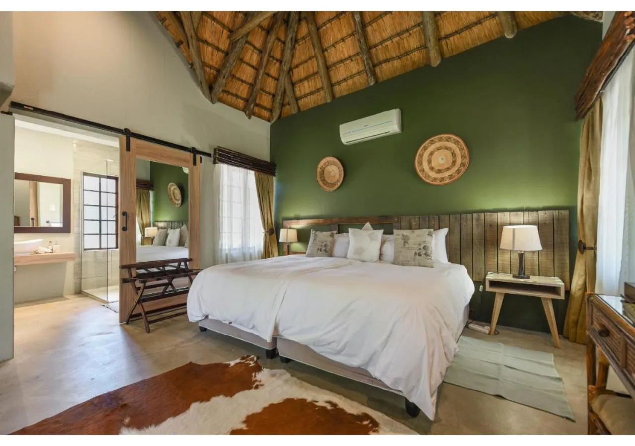 Bed in Mziki Safari Lodge