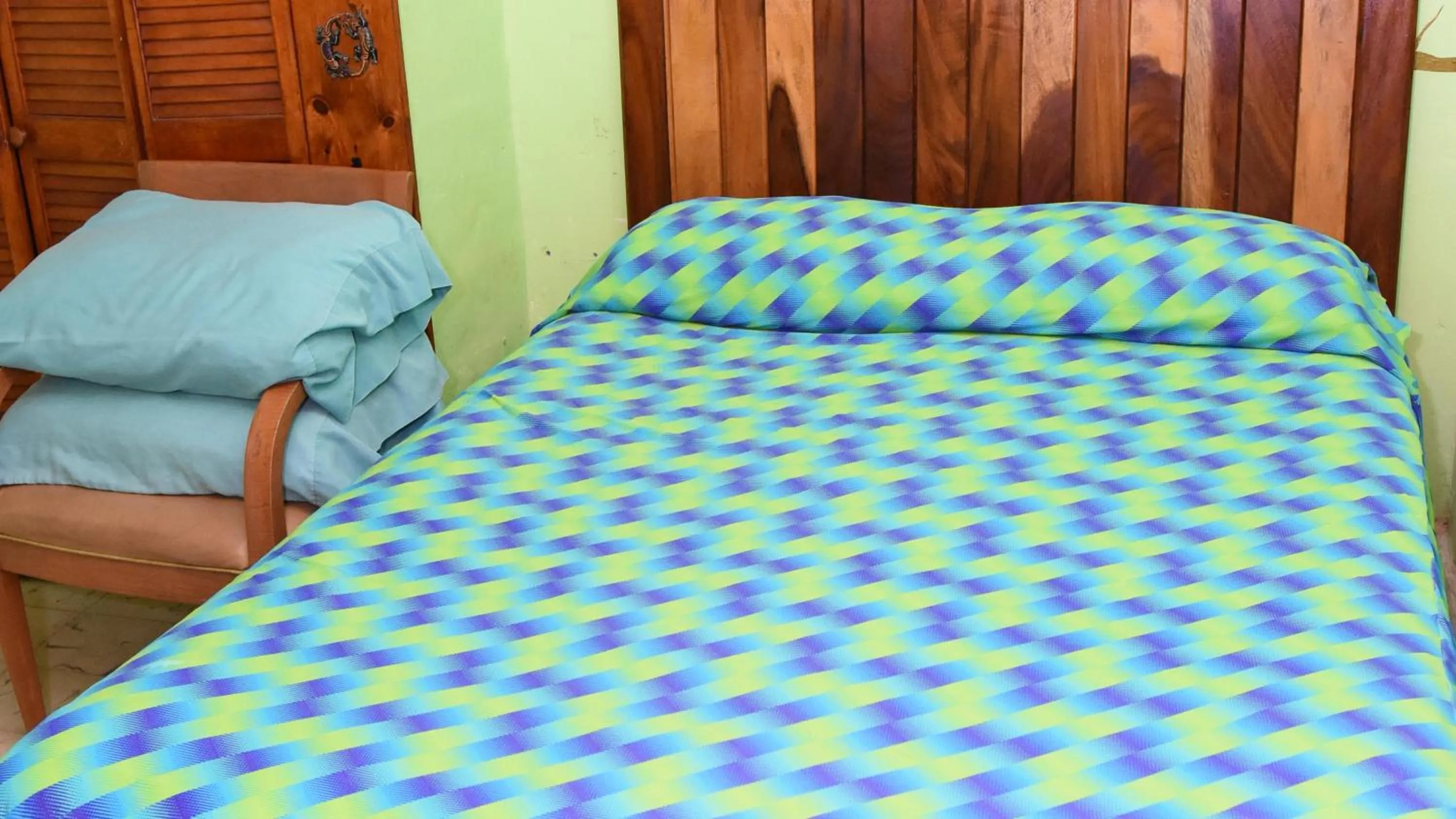 Bed in Cancun Guest House 6