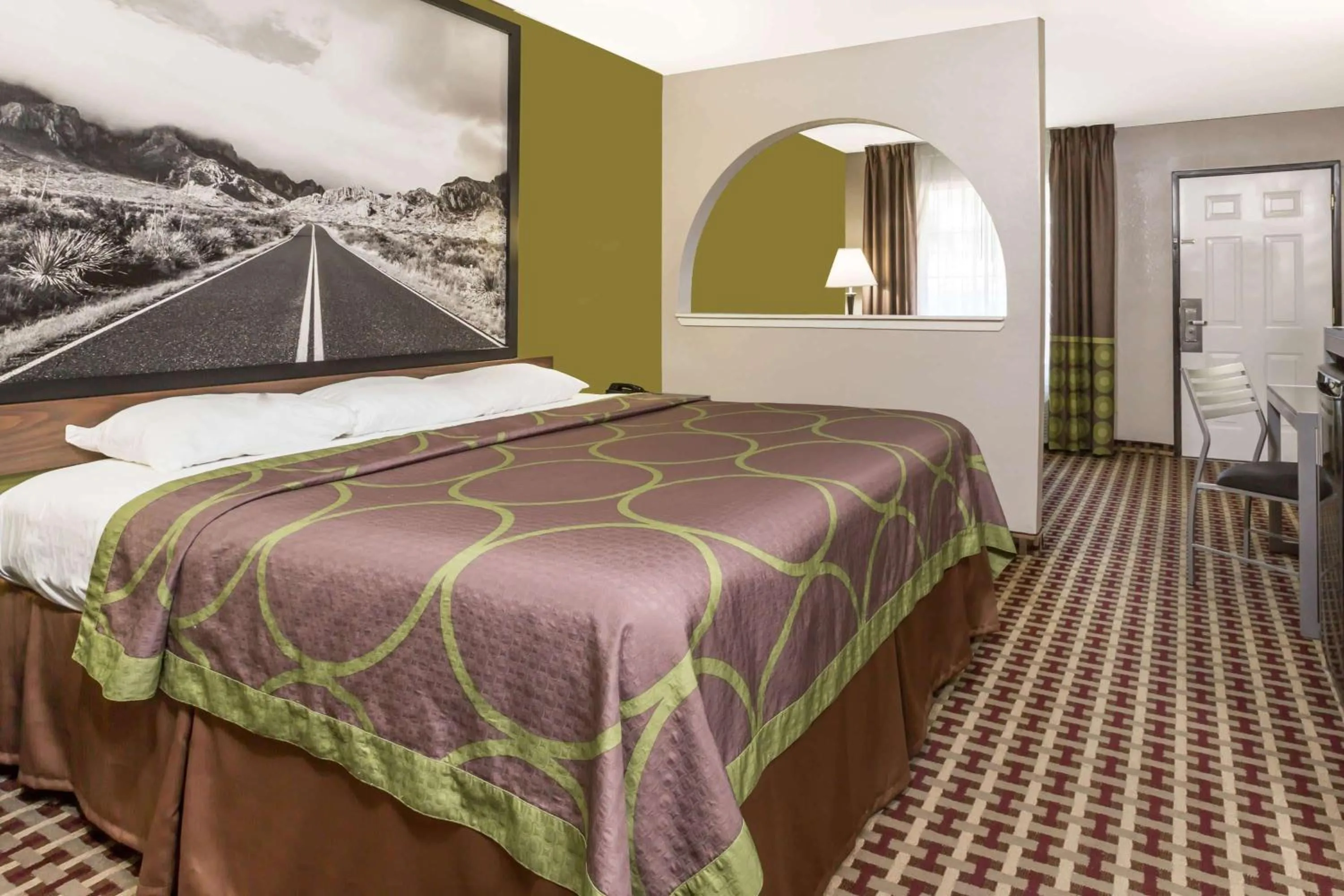 Bed in Super 8 by Wyndham Houston Webster NASA