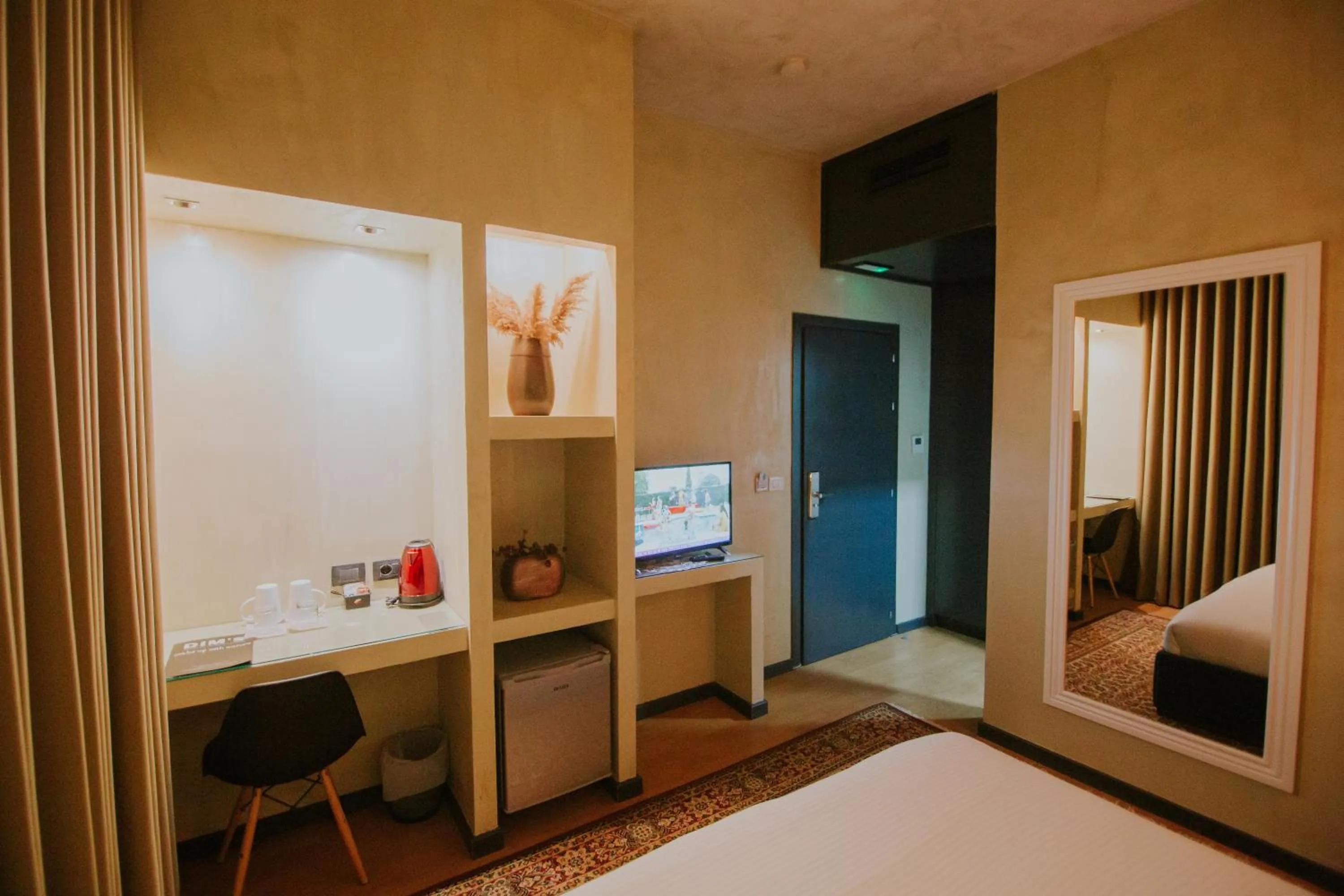 Bed in Dim's Hotel & Restaurant