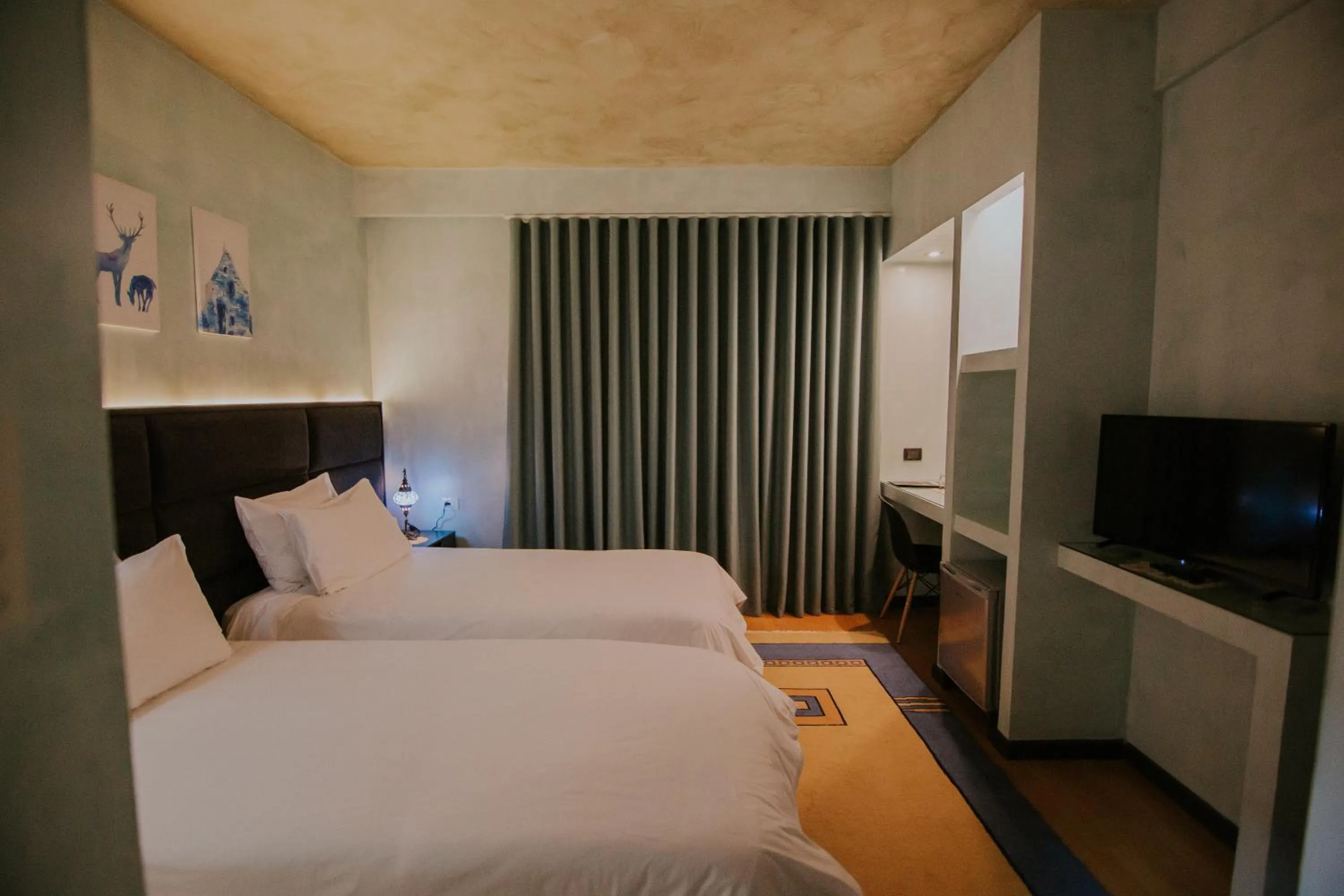 Bed in Dim's Hotel & Restaurant