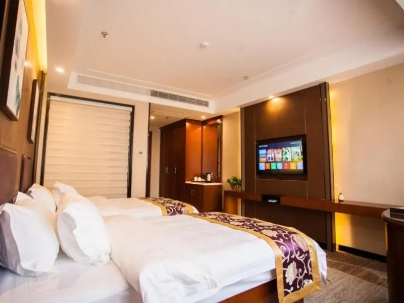 Bed in GreenTree Eastern Bozhou Jingwan Wealth Centre Hotel