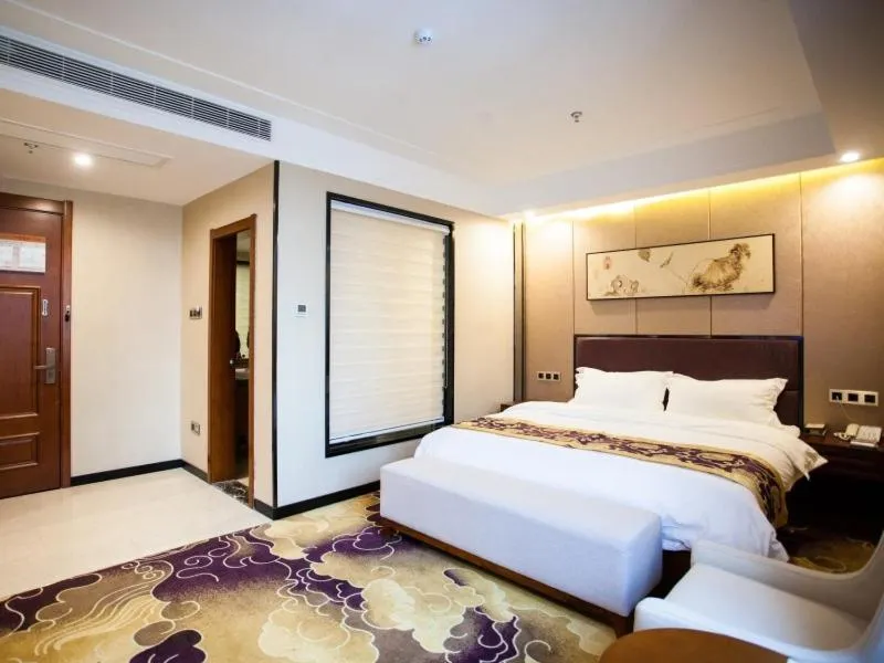 Bed in GreenTree Eastern Bozhou Jingwan Wealth Centre Hotel