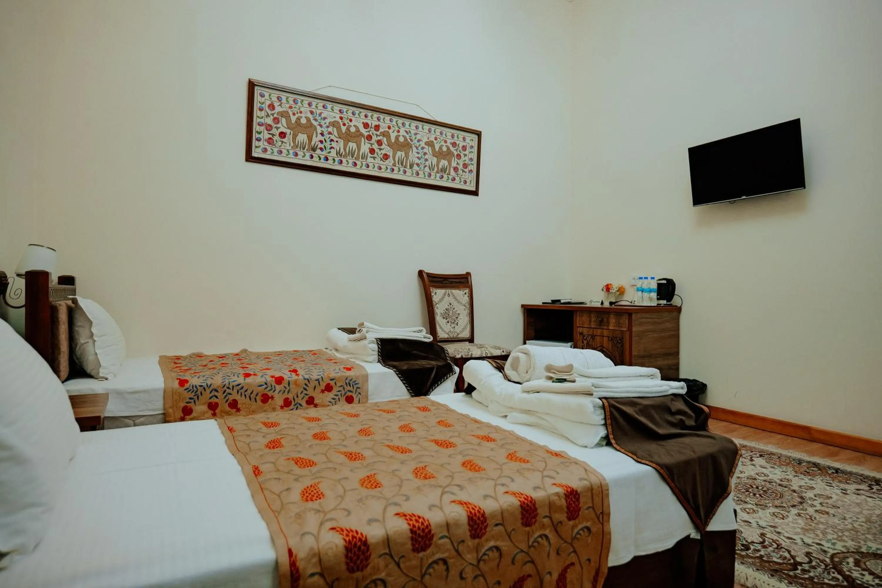 Communal lounge/ TV room in Imperial Palace Bukhara