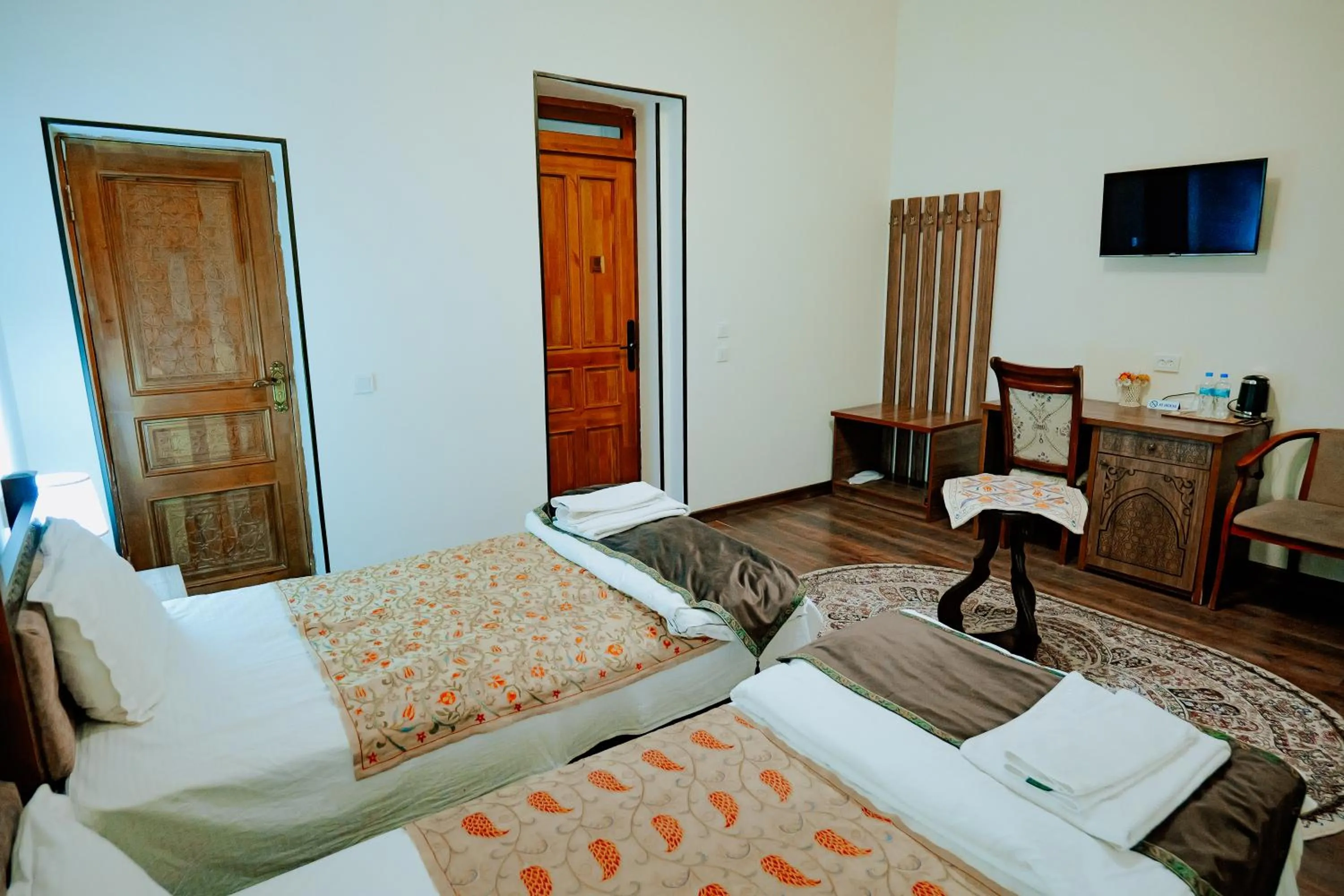 Communal lounge/ TV room in Imperial Palace Bukhara