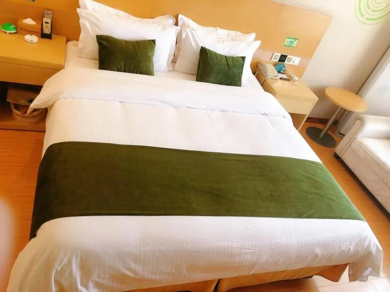 Bed in GreenTree Inn Xinyang Gushi County Yucheng Avenue Express Hotel