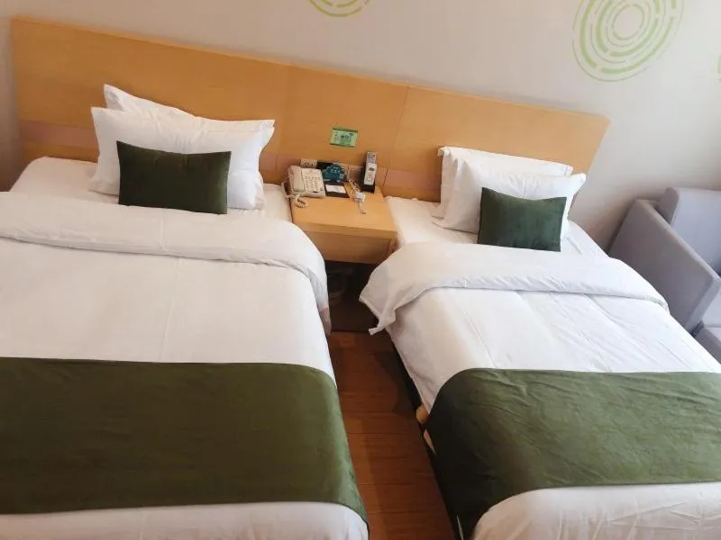 Bed in GreenTree Inn Xinyang Gushi County Yucheng Avenue Express Hotel