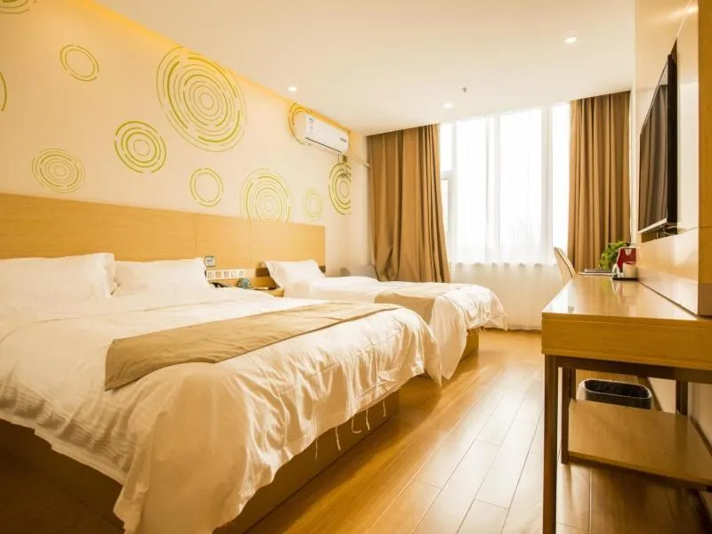 Bed in GreenTree Inn Handan Wei County Xianbiao Business Hotel