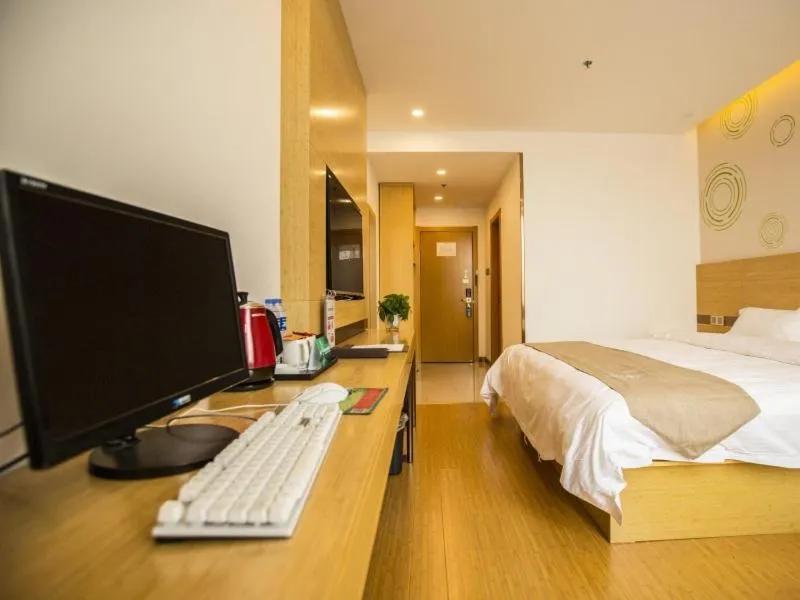 Bed in GreenTree Inn Handan Wei County Xianbiao Business Hotel