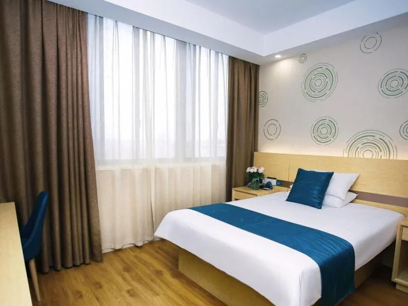 Bed in GreenTree Inn NantongHaian Development Zone Chengdong Town Express Hotel