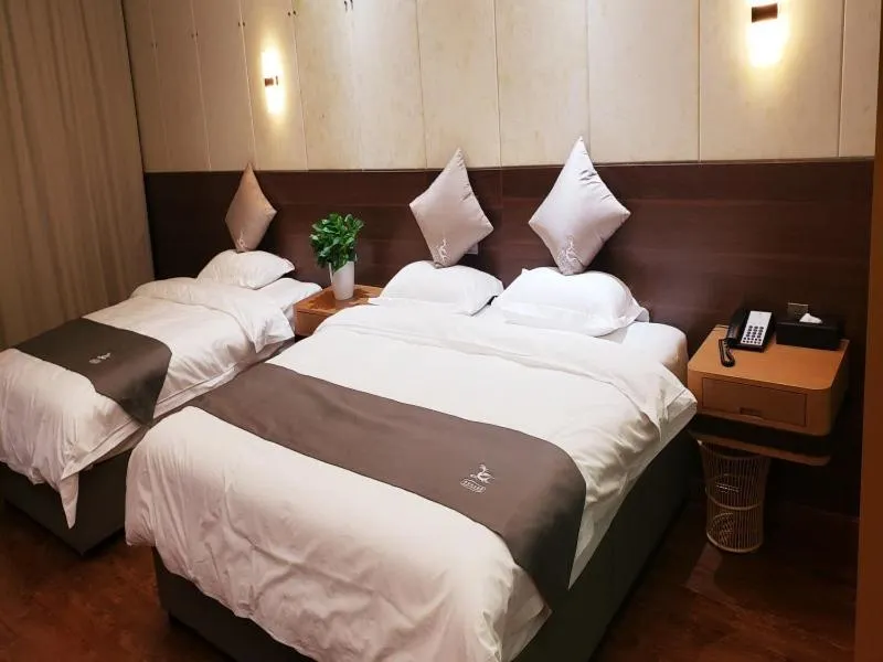 Bed in GreenTree Eastern Rizhao High Speed Railway Station Hotel