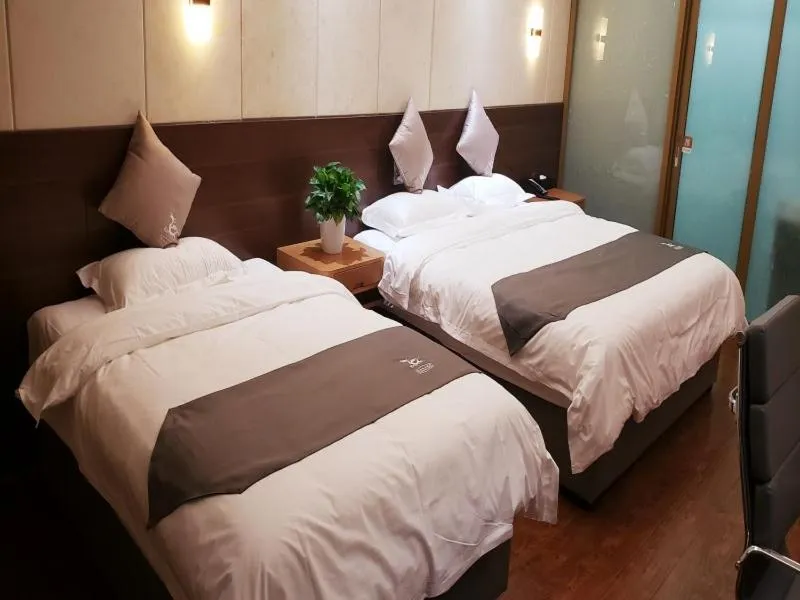 Bed in GreenTree Eastern Rizhao High Speed Railway Station Hotel