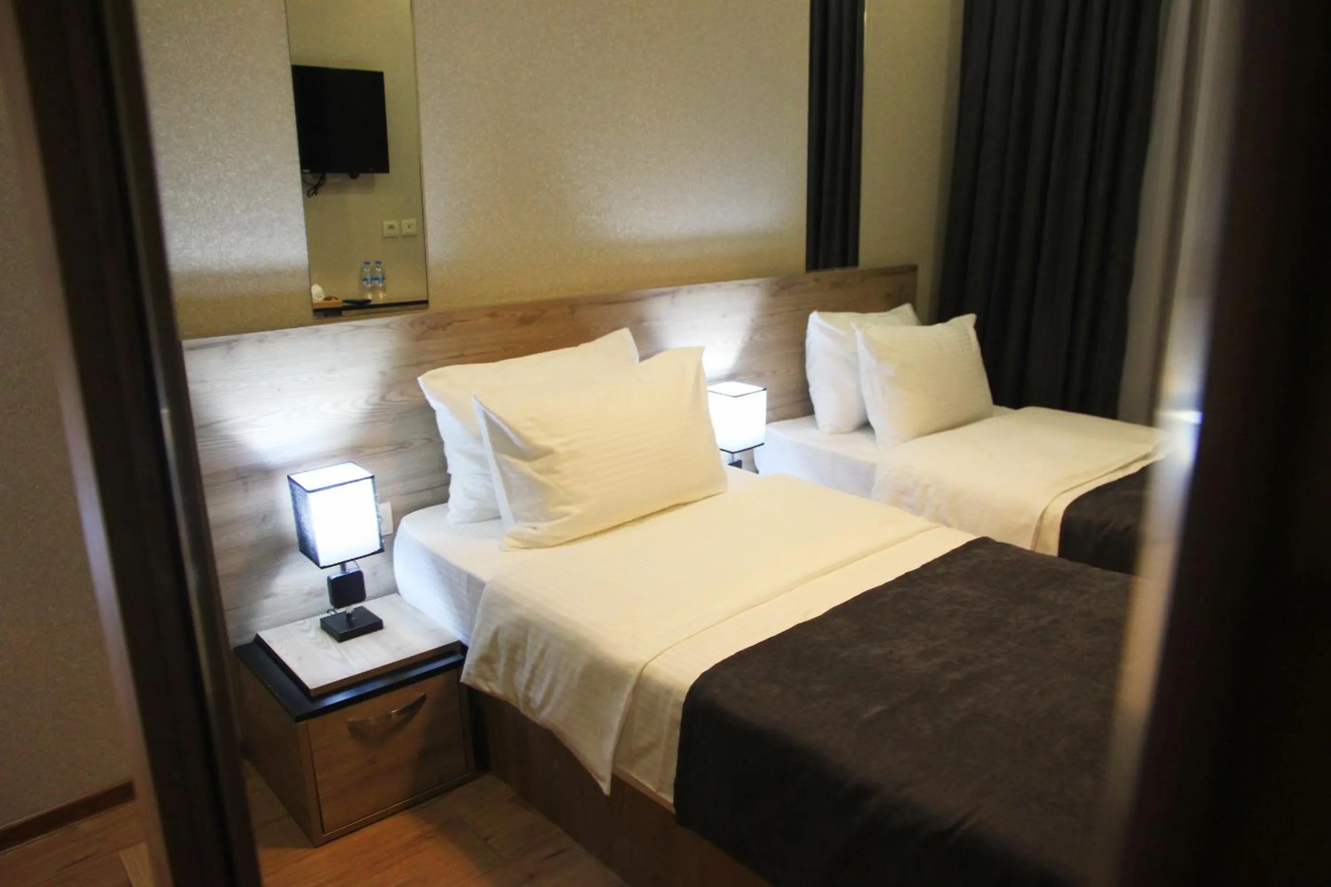 Bed in City Heart Hotel