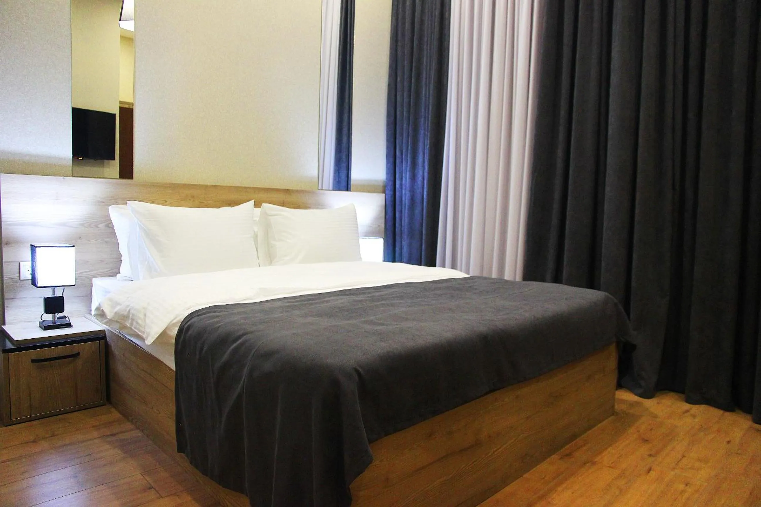 Bed in City Heart Hotel