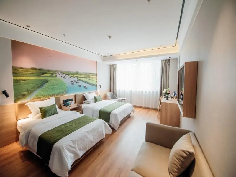 Bed in GreenTree Inn Taizhou Xinghua City Zhouzhuang Town Business Hotel