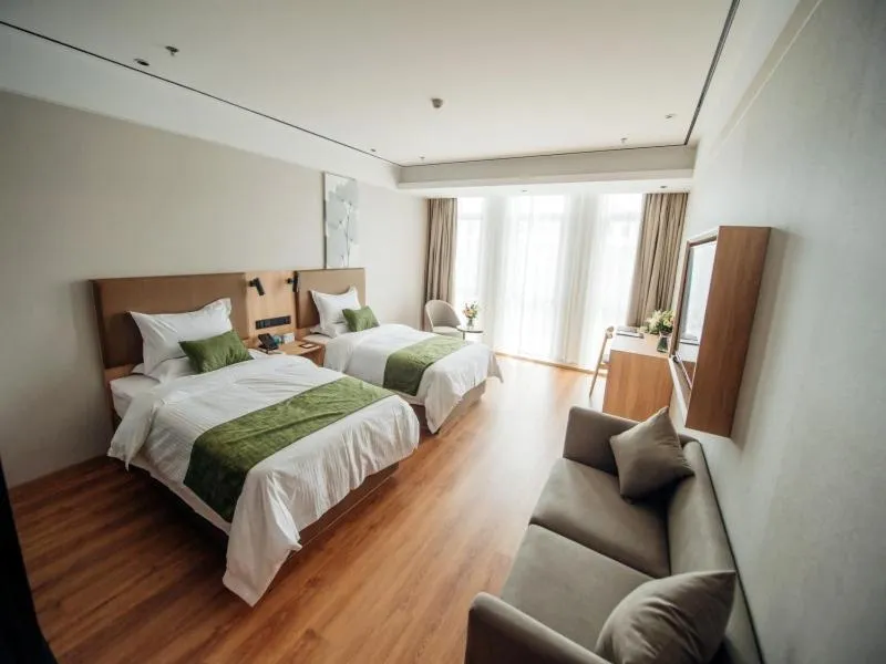 Bed in GreenTree Inn Taizhou Xinghua City Zhouzhuang Town Business Hotel