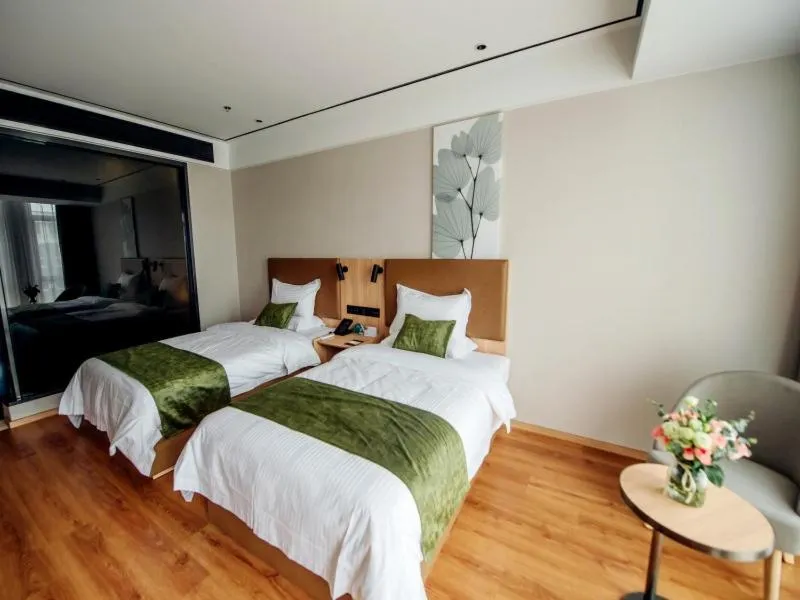 Bed in GreenTree Inn Taizhou Xinghua City Zhouzhuang Town Business Hotel
