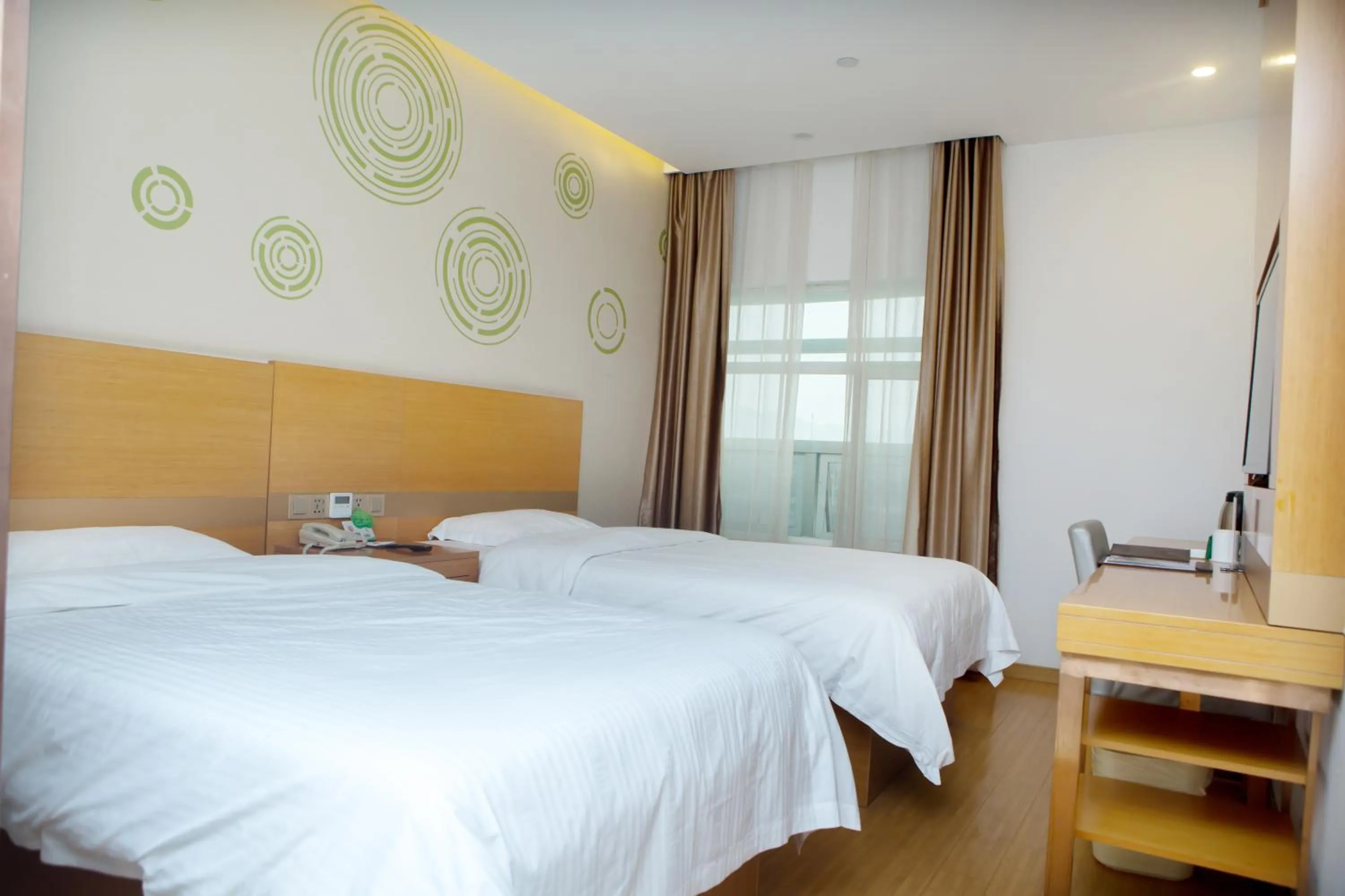 Bed in GreenTree Inn Yangzhou Railway Station Jinzhankou Business Hotel