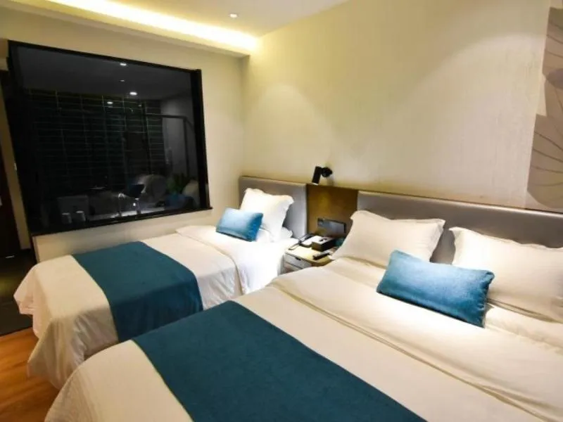 Bed in GreenTree Rizhao Lanshan Coach Station Hotel