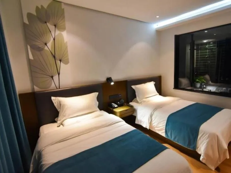 Bed in GreenTree Rizhao Lanshan Coach Station Hotel