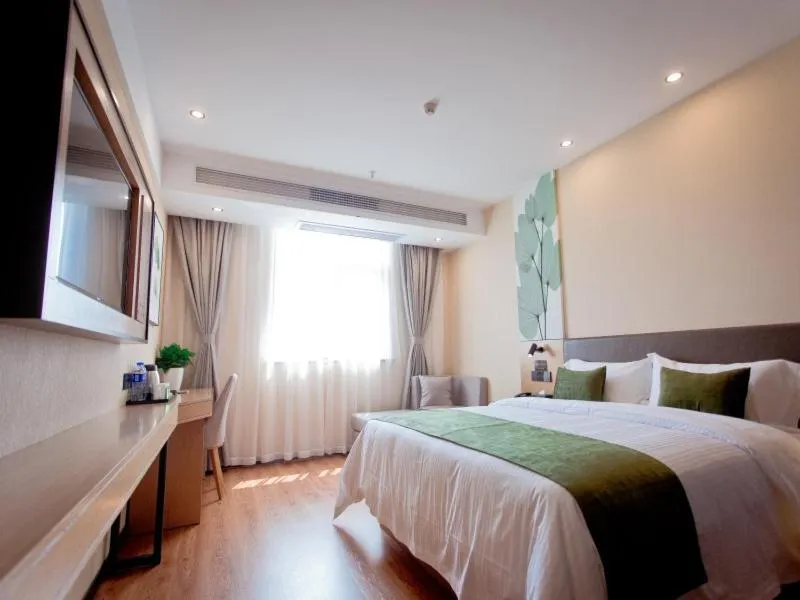 Bed in GreenTree Inn Fuyang City Yingzhou District Kuixing Road Business Hotel