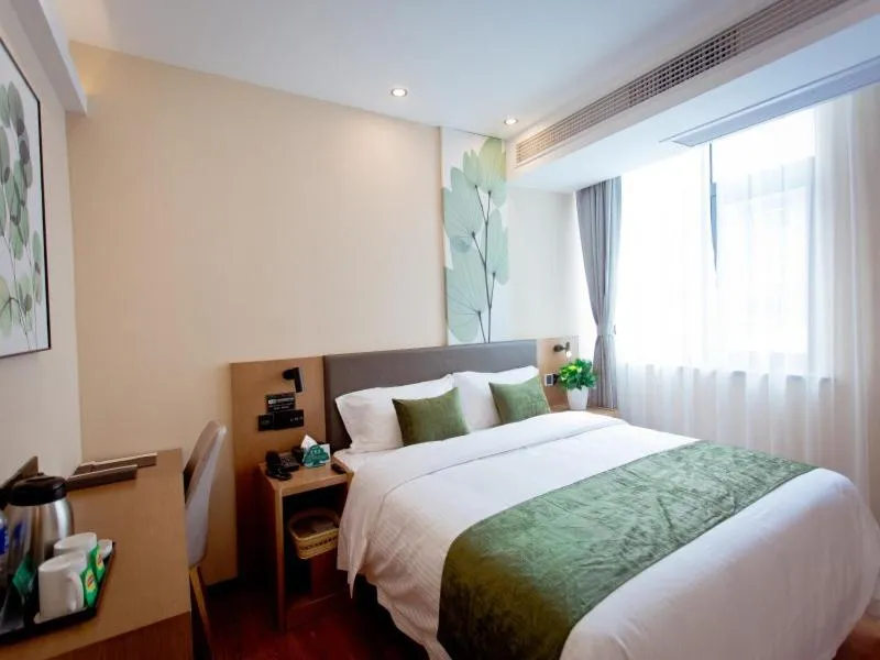 Bed in GreenTree Inn Fuyang City Yingzhou District Kuixing Road Business Hotel