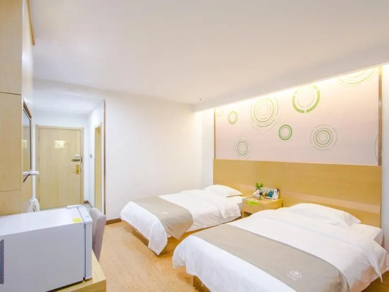Bed in GreenTree Inn Xingxincheng Town Jiayuan Central Plaza Business Hotel