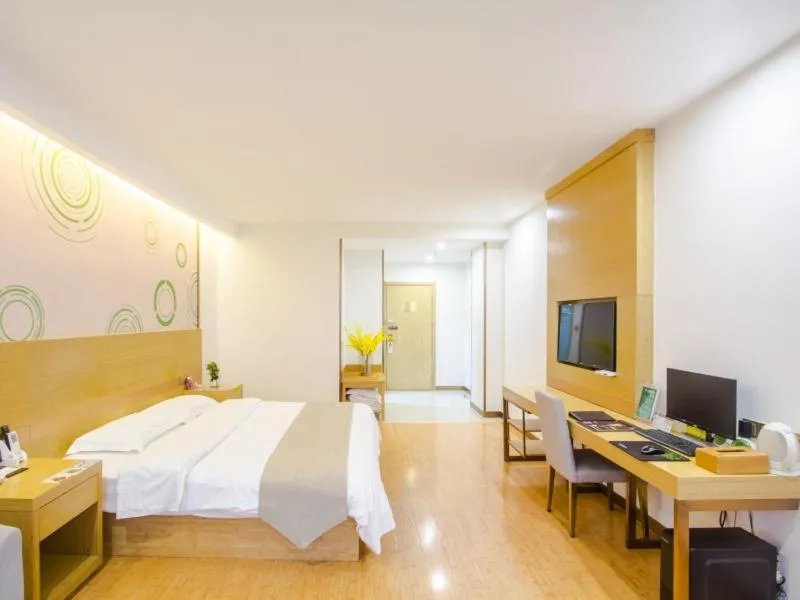 Bed in GreenTree Inn Xingxincheng Town Jiayuan Central Plaza Business Hotel